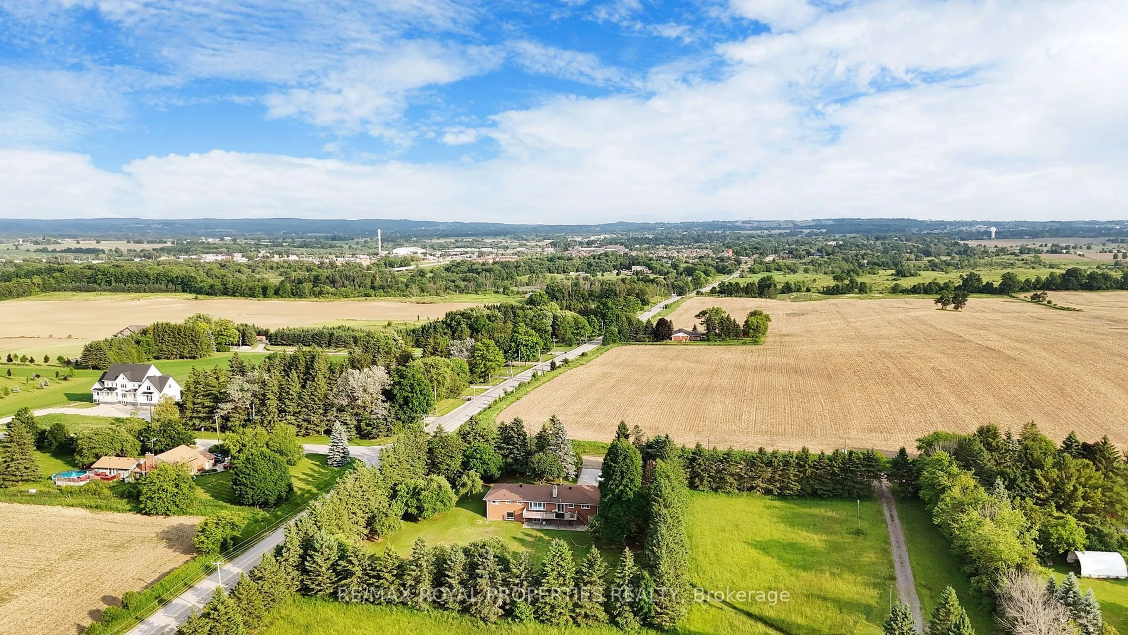 A pic from outside/outdoor area/front of a property/back of a property/a pic from drone, forest/trees view for 4822 2nd Line, New Tecumseth Ontario L0G 1T0