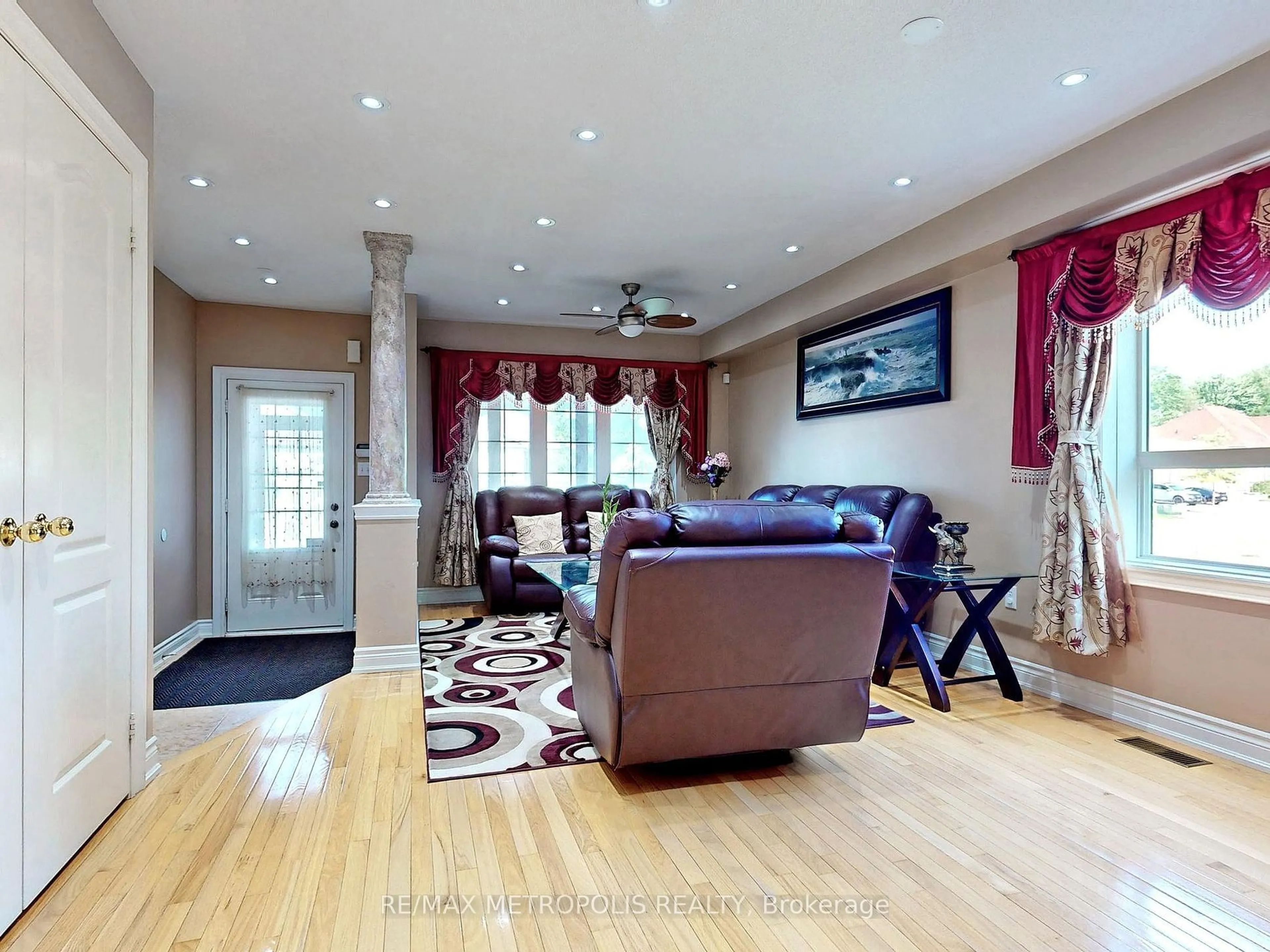 Living room with furniture, wood/laminate floor for 263 Greenwood Dr, Essa Ontario L3W 0E9