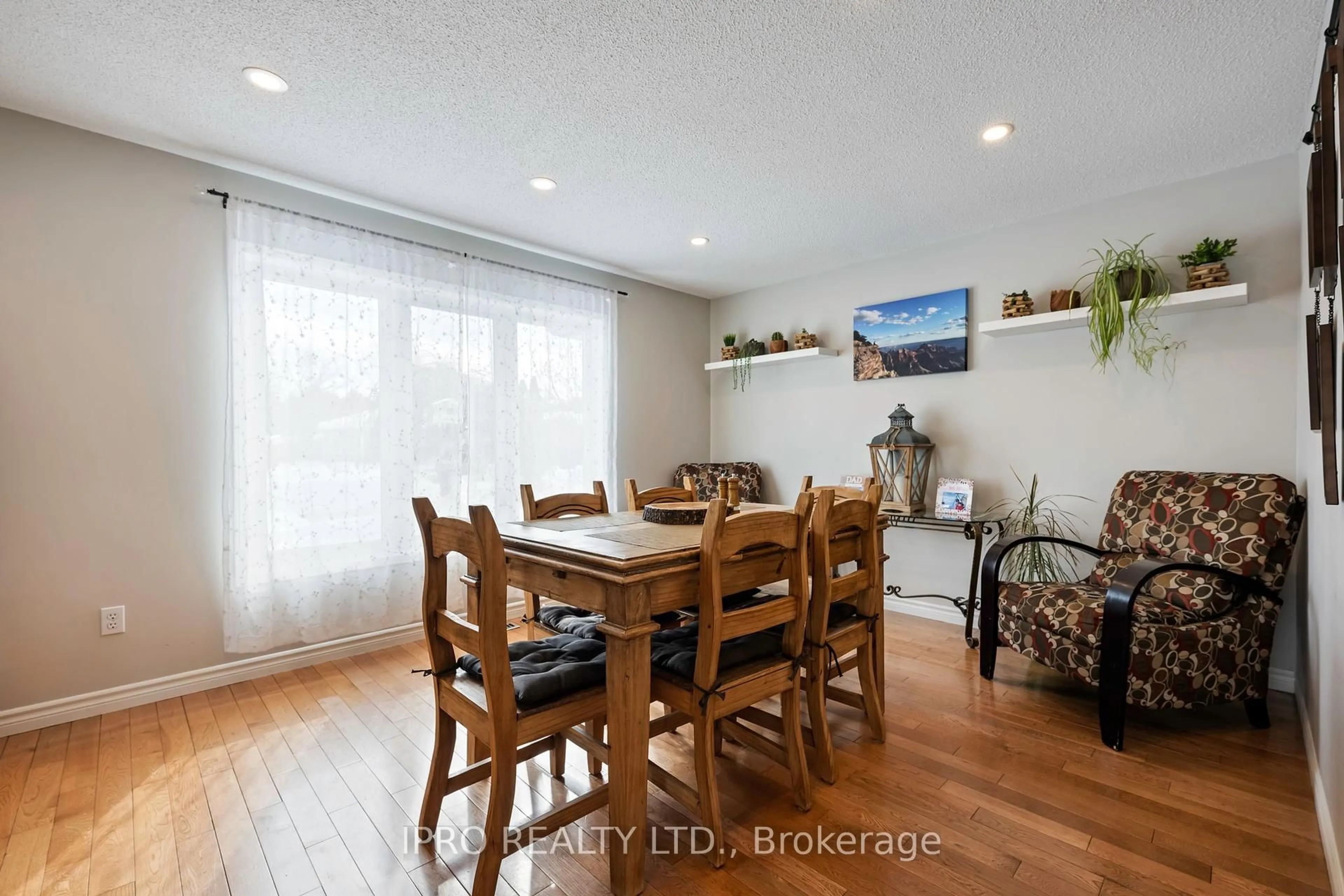 Dining room, wood/laminate floor for 11 Mcqueen St, Essa Ontario L0M 1B0