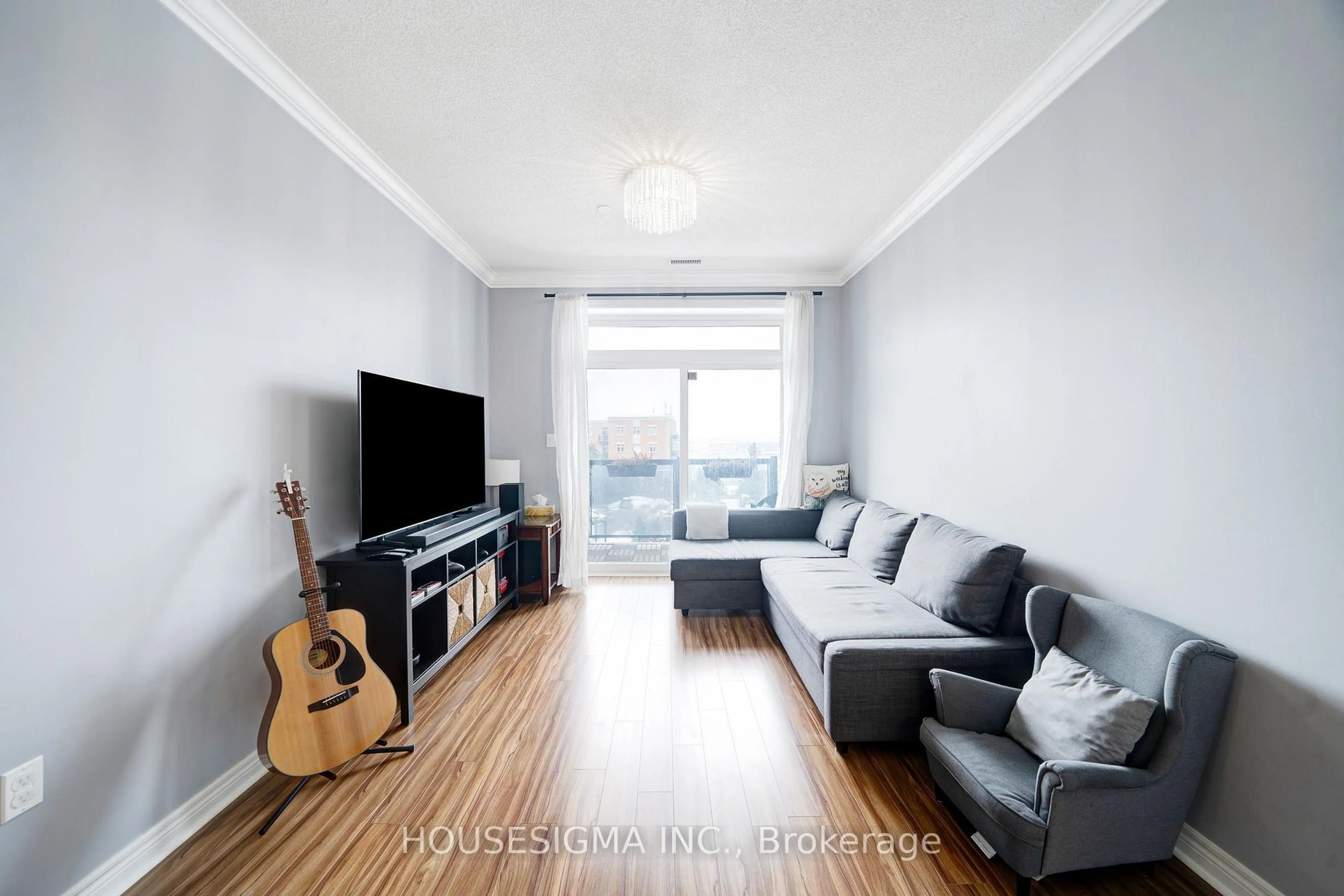 Living room with furniture, wood/laminate floor for 7768 Kennedy Rd #401, Markham Ontario L3R 5K1