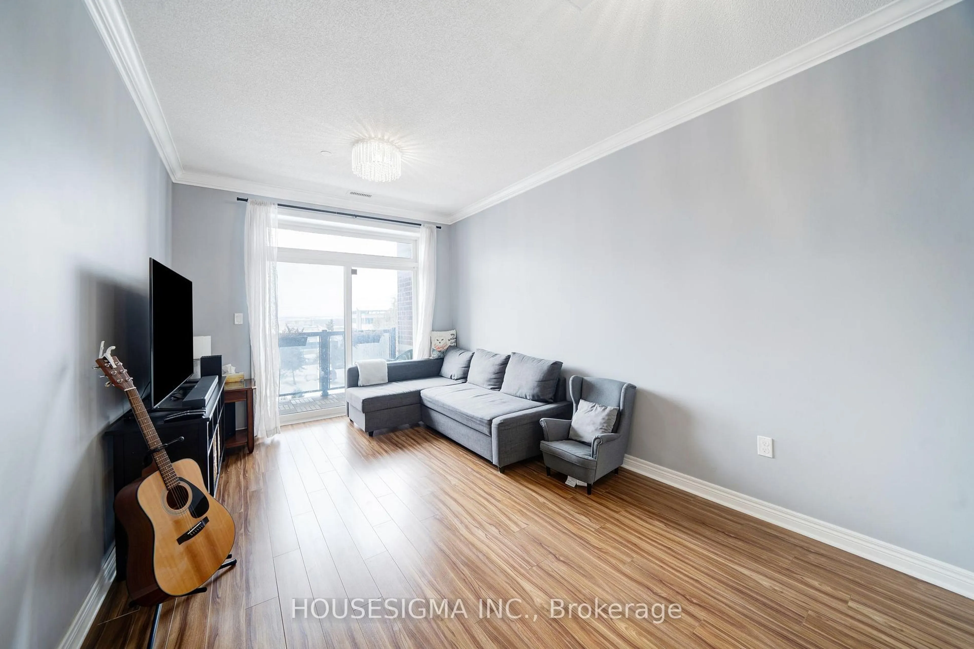 Living room with furniture, wood/laminate floor for 7768 Kennedy Rd #401, Markham Ontario L3R 5K1