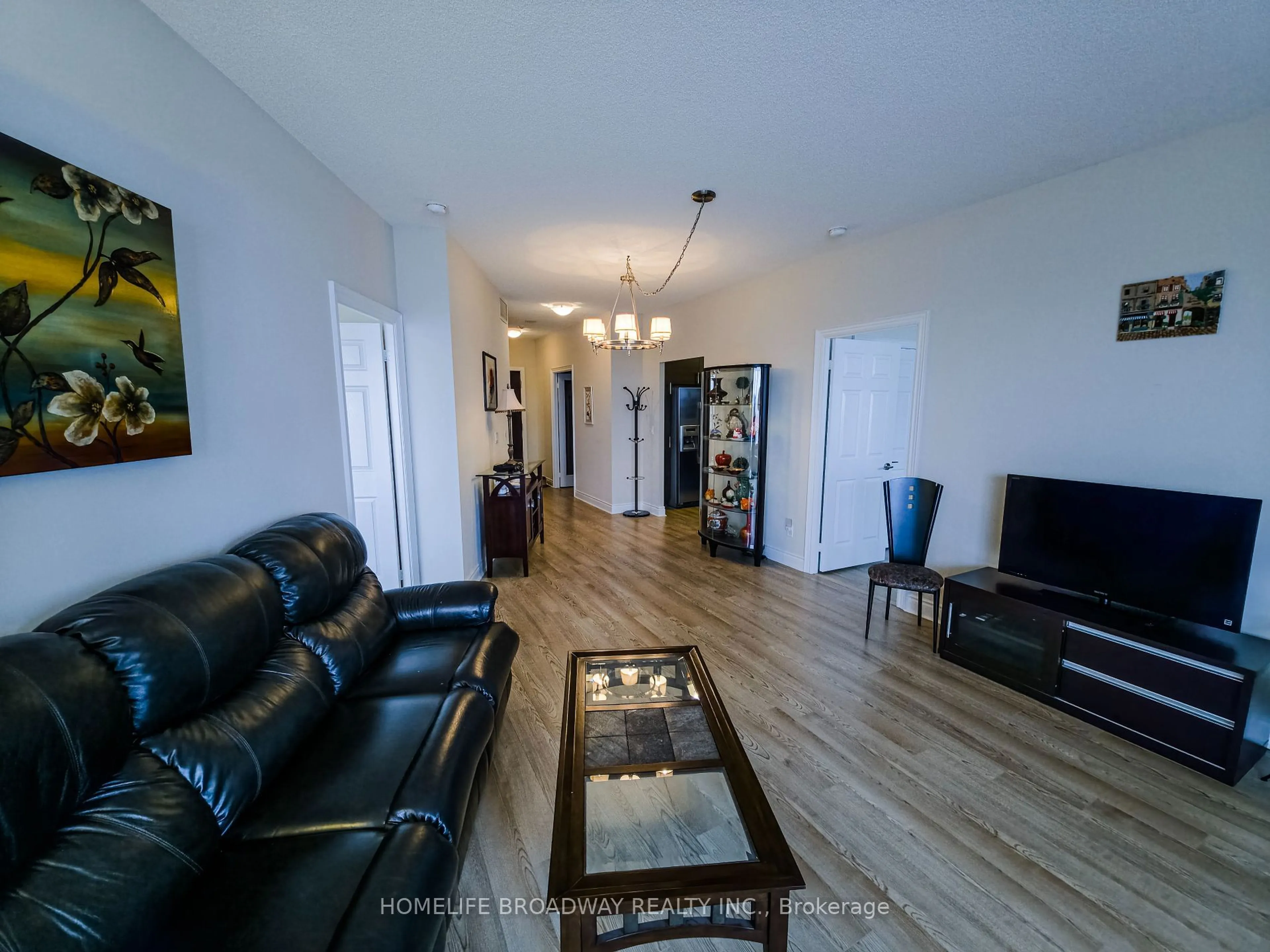 Living room with furniture, wood/laminate floor for 23 Cox Blvd #263, Markham Ontario L3R 7Z9