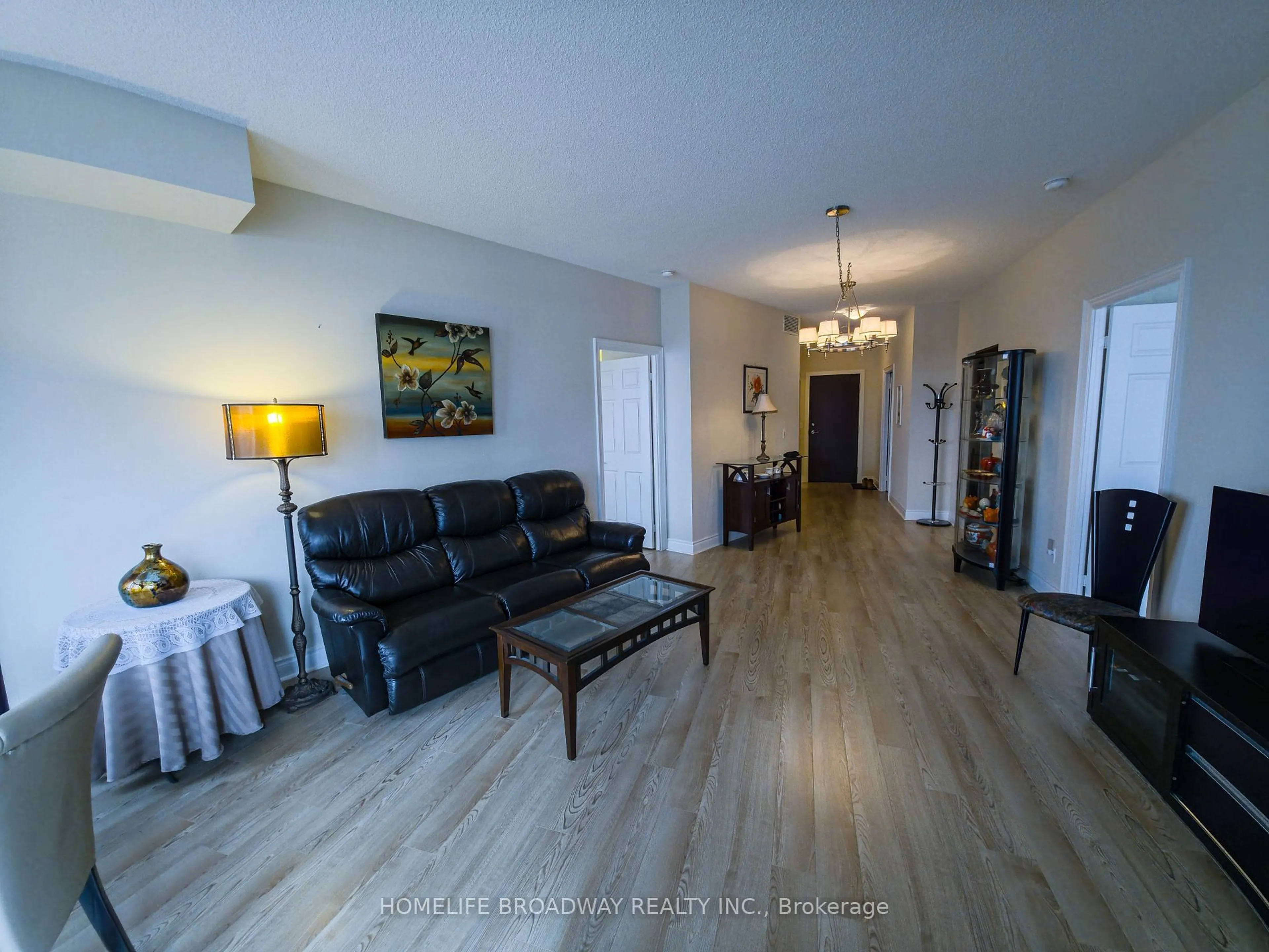 Living room with furniture, wood/laminate floor for 23 Cox Blvd #263, Markham Ontario L3R 7Z9