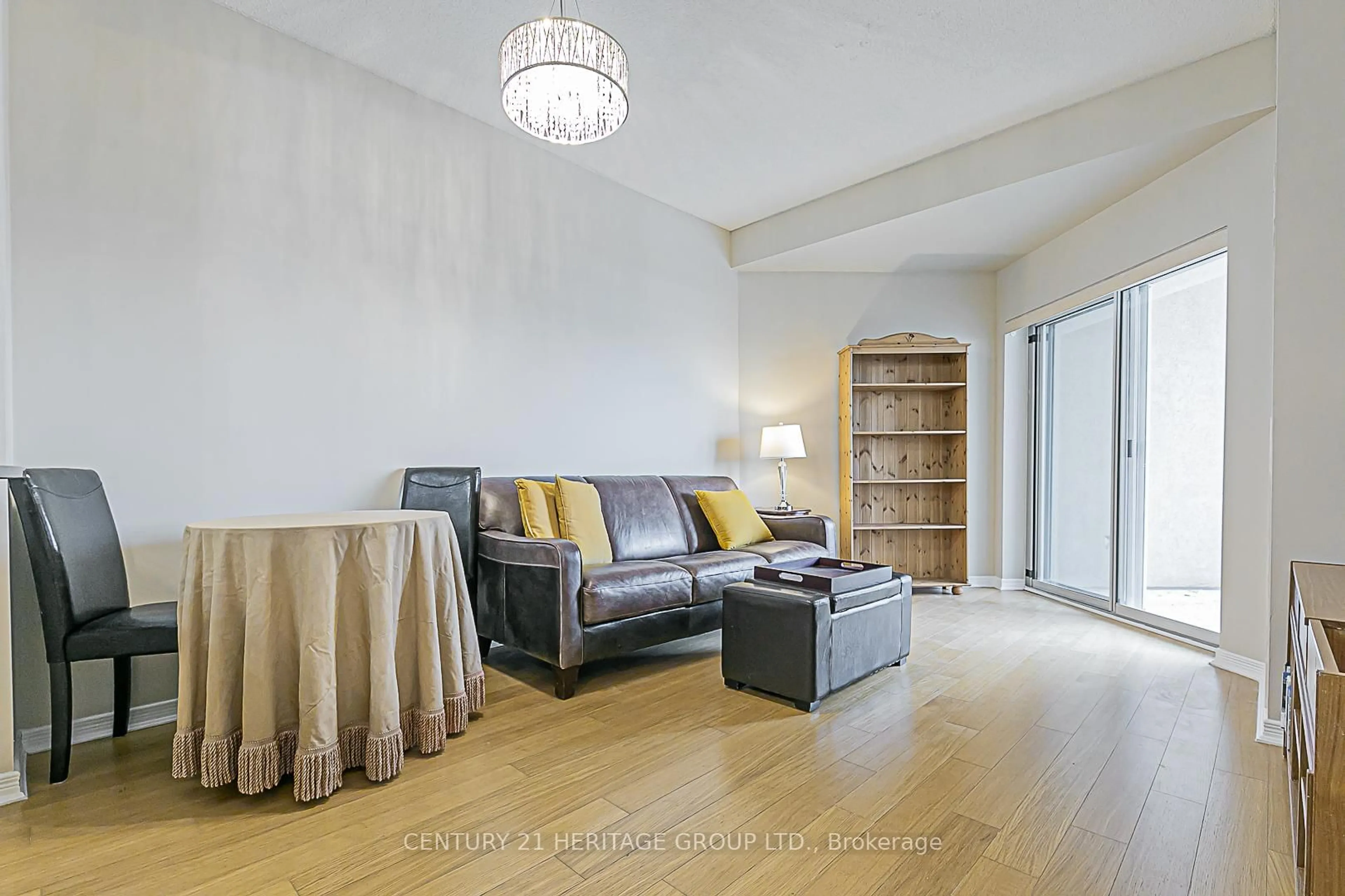 Living room with furniture, wood/laminate floor for 8 Maison Parc Crt #305, Vaughan Ontario L4J 9K5