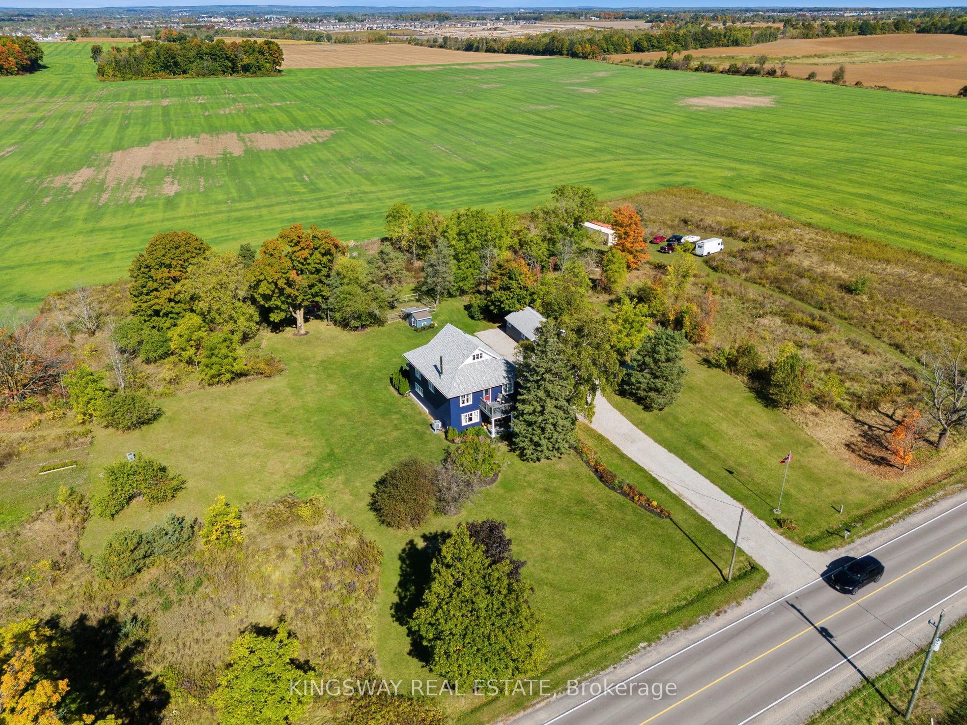 A pic from outside/outdoor area/front of a property/back of a property/a pic from drone, street for 2612 10th Line, Innisfil Ontario L9S 3R2