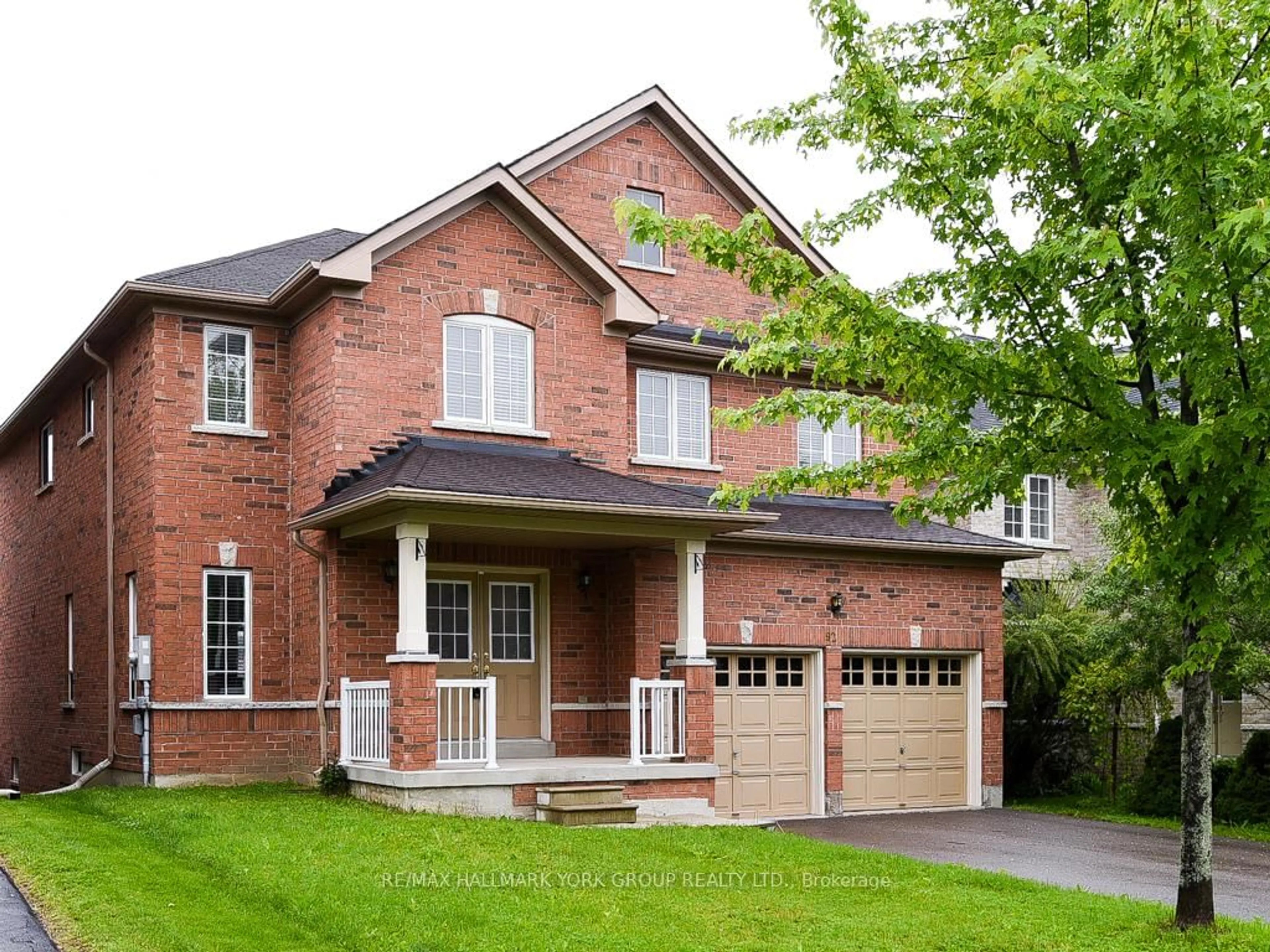 Home with brick exterior material, street for 92 Memorial Gardens Way, Newmarket Ontario L3X 3A7