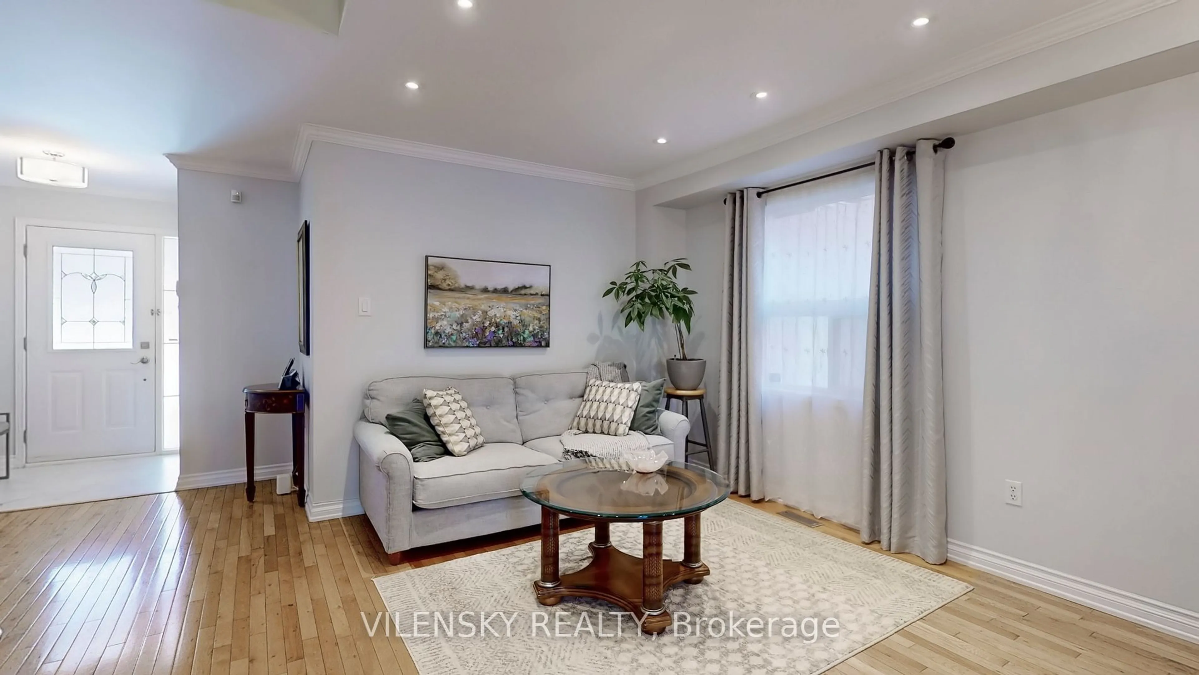 Living room with furniture, wood/laminate floor for 101 Foxfield Cres, Vaughan Ontario L4K 5E9