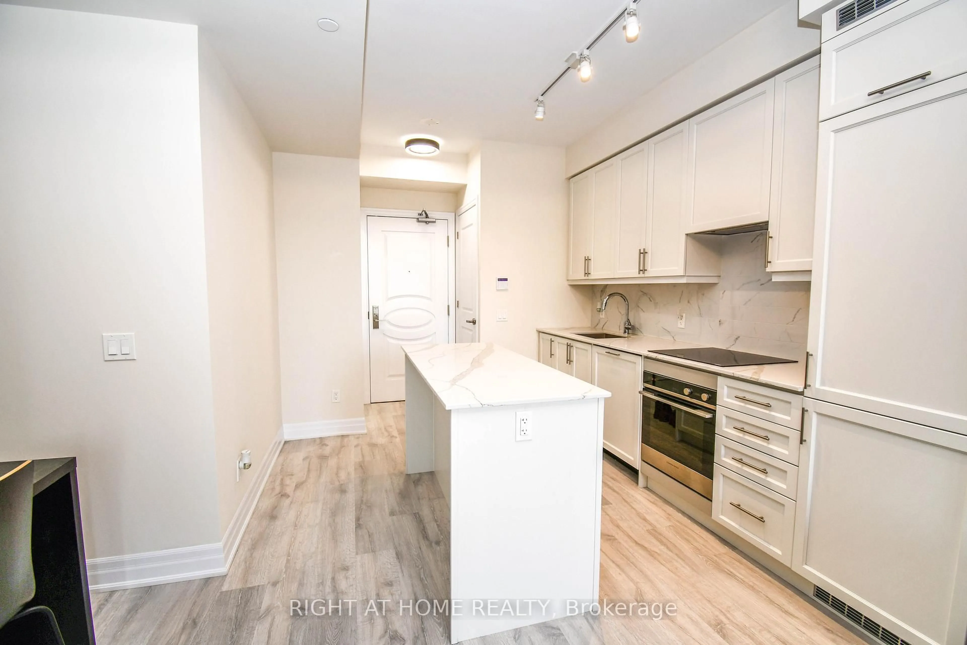 Open concept kitchen, wood/laminate floor for 9085 Jane St #811, Vaughan Ontario L4K 5P1