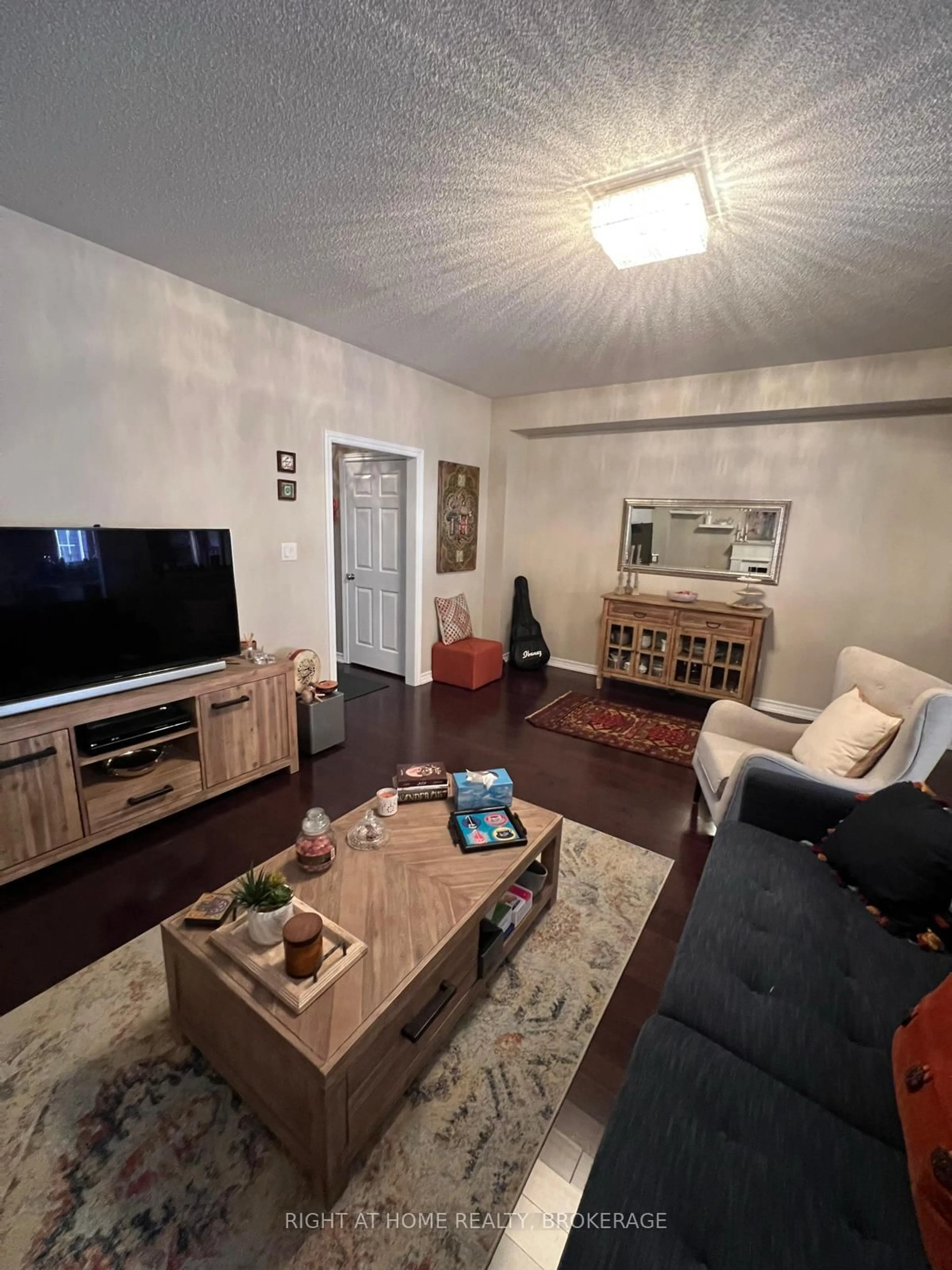 Living room with furniture, wood/laminate floor for 60 Zachary Pl, Vaughan Ontario L4H 3S4