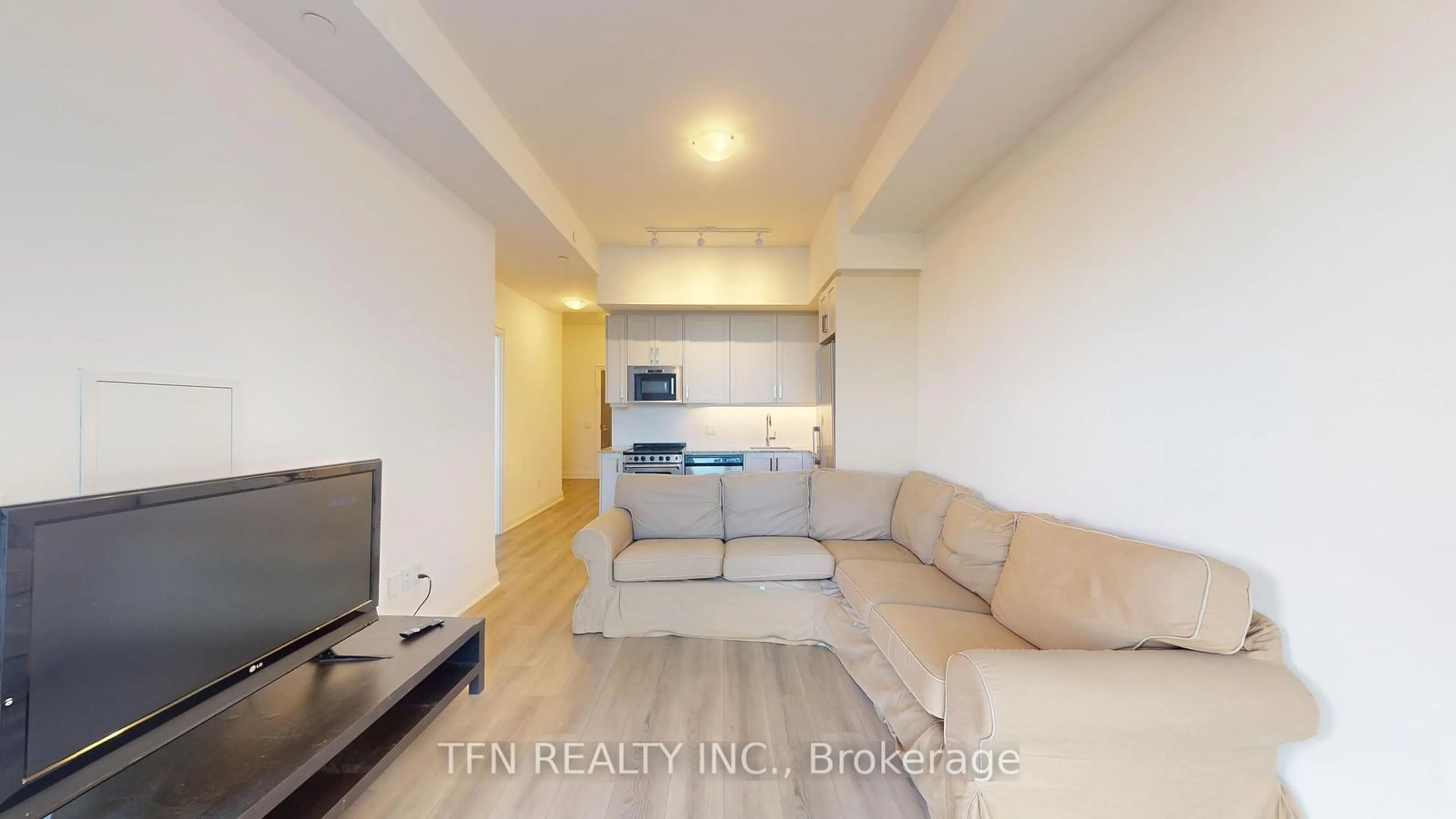Living room with furniture, wood/laminate floor for 10 Gatineau Dr #209, Vaughan Ontario L4J 0L2