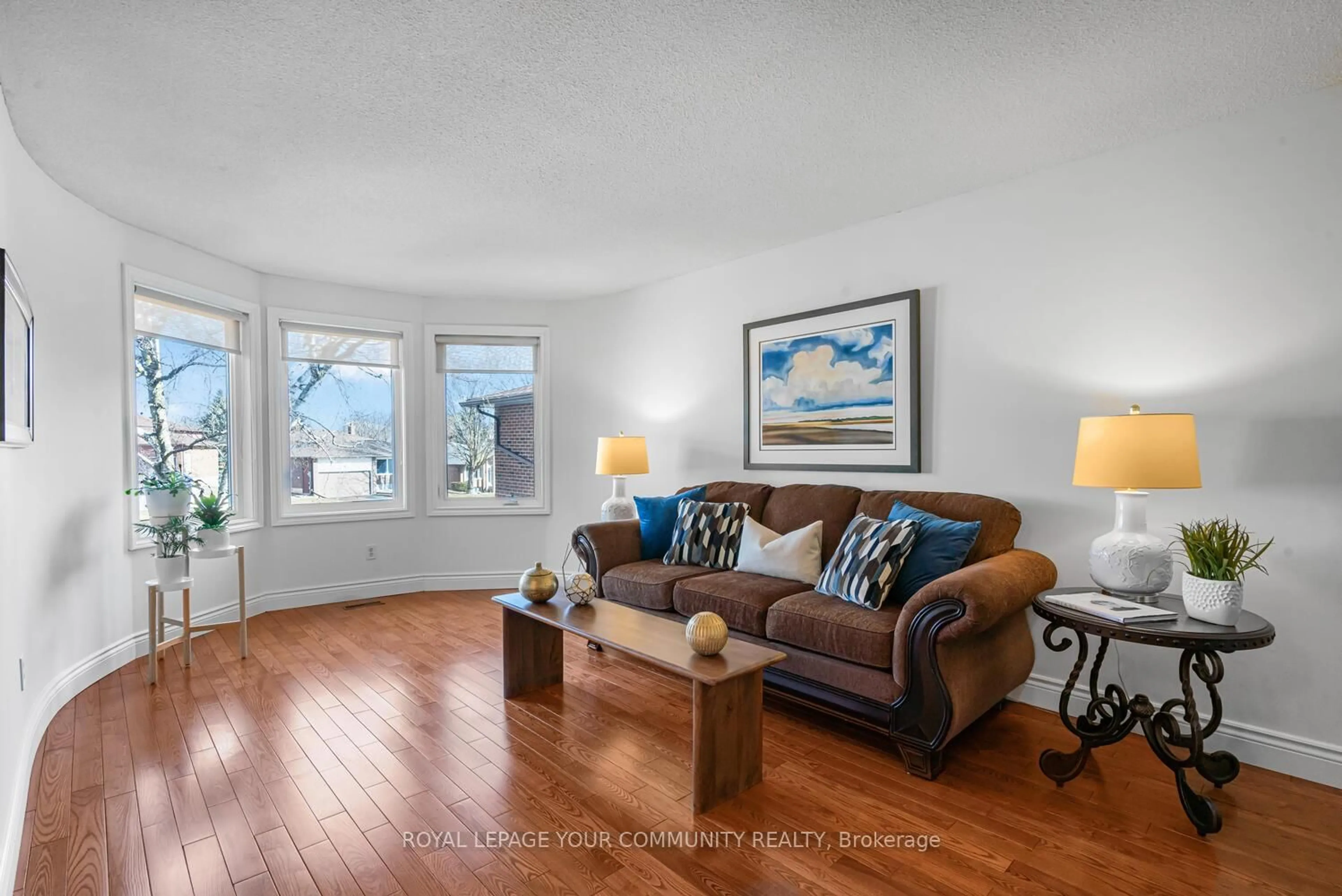 Living room with furniture, wood/laminate floor for 42 Portland Cres, Newmarket Ontario L3Y 6A5