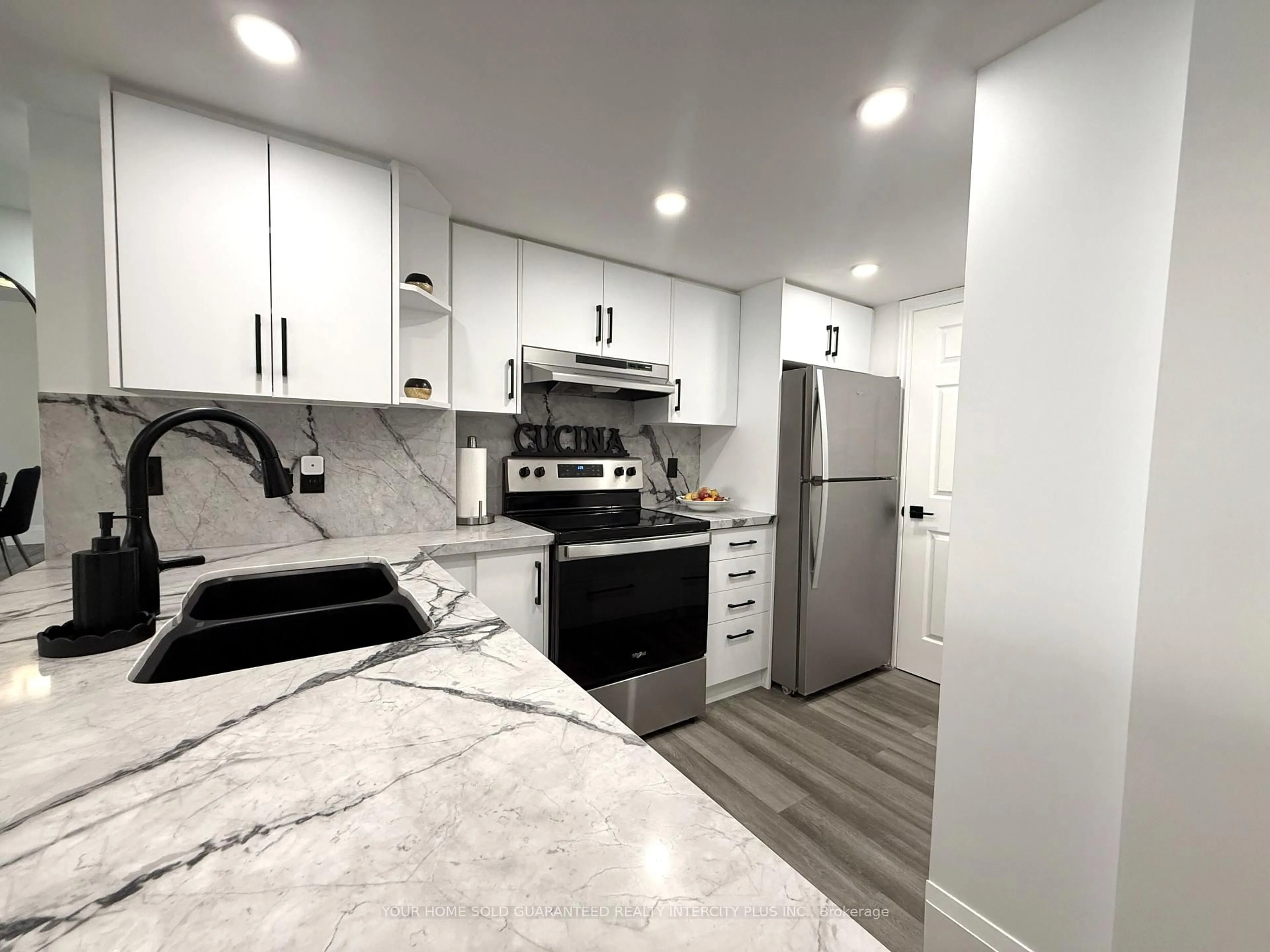 Open concept kitchen, ceramic/tile floor for 121 Woodbridge Ave #313, Vaughan Ontario L4L 9E3