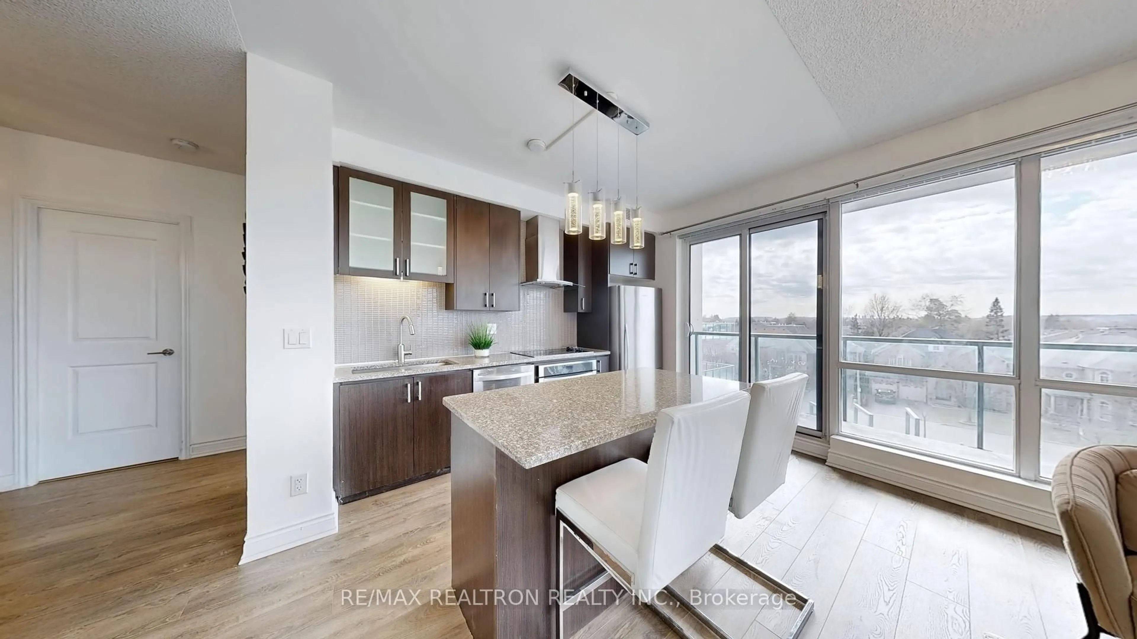 Open concept kitchen, wood/laminate floor for 9088 Yonge St #302A, Richmond Hill Ontario L4C 0Y6