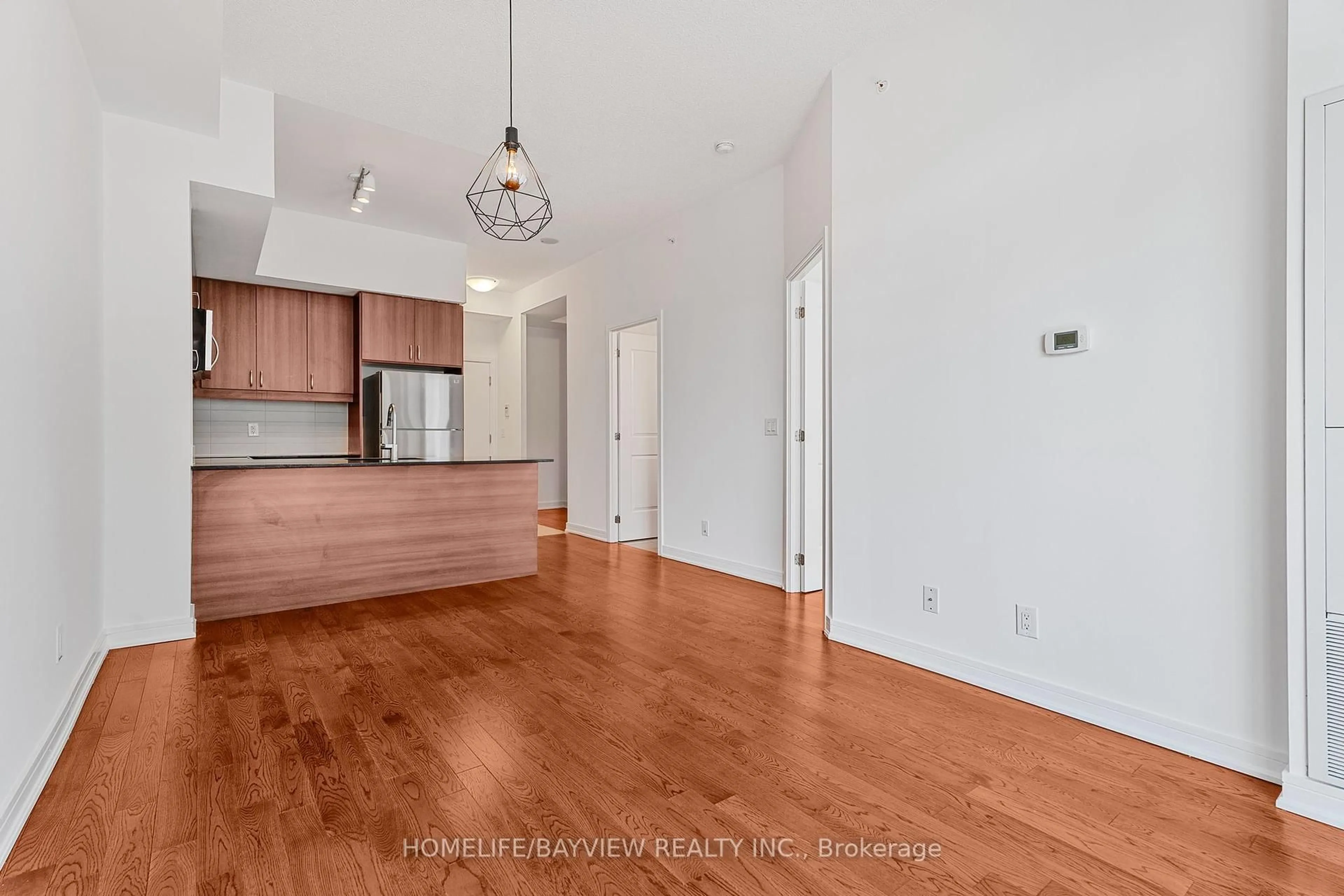 Open concept kitchen, wood/laminate floor for 9205 Yonge St #811NE, Richmond Hill Ontario L4C 6Z2