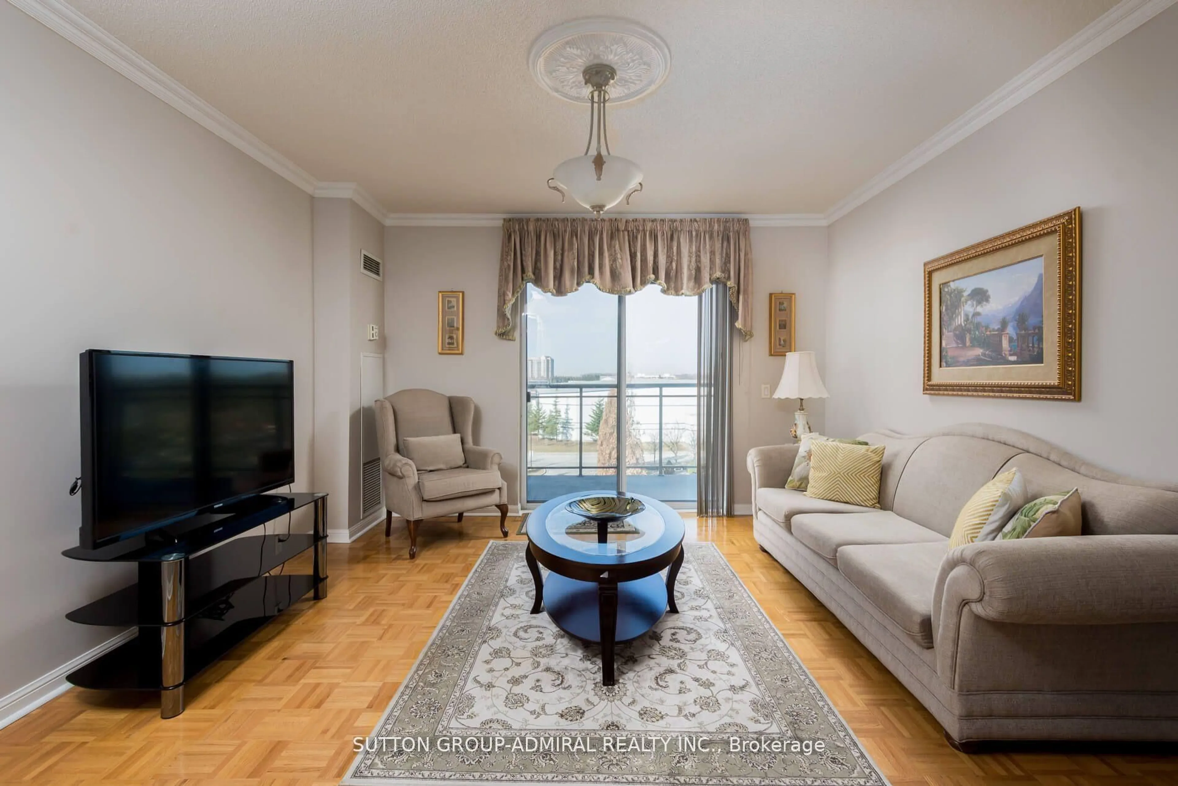 Living room with furniture, wood/laminate floor for 2504 Rutherford Rd #509, Vaughan Ontario L4K 5N5