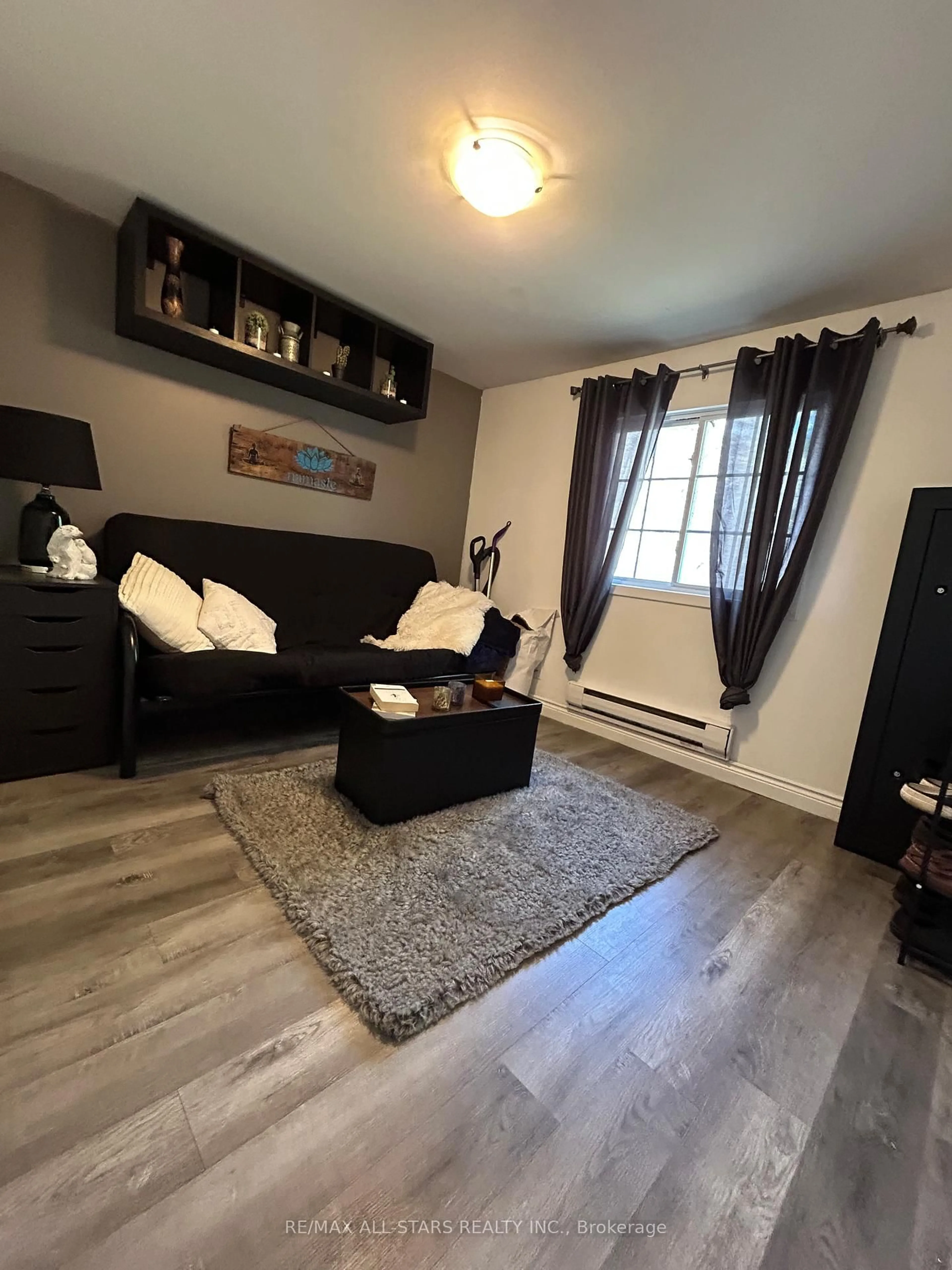 Living room with furniture, wood/laminate floor for 23495 Lakeridge Rd, Brock Ontario L0E 1E0