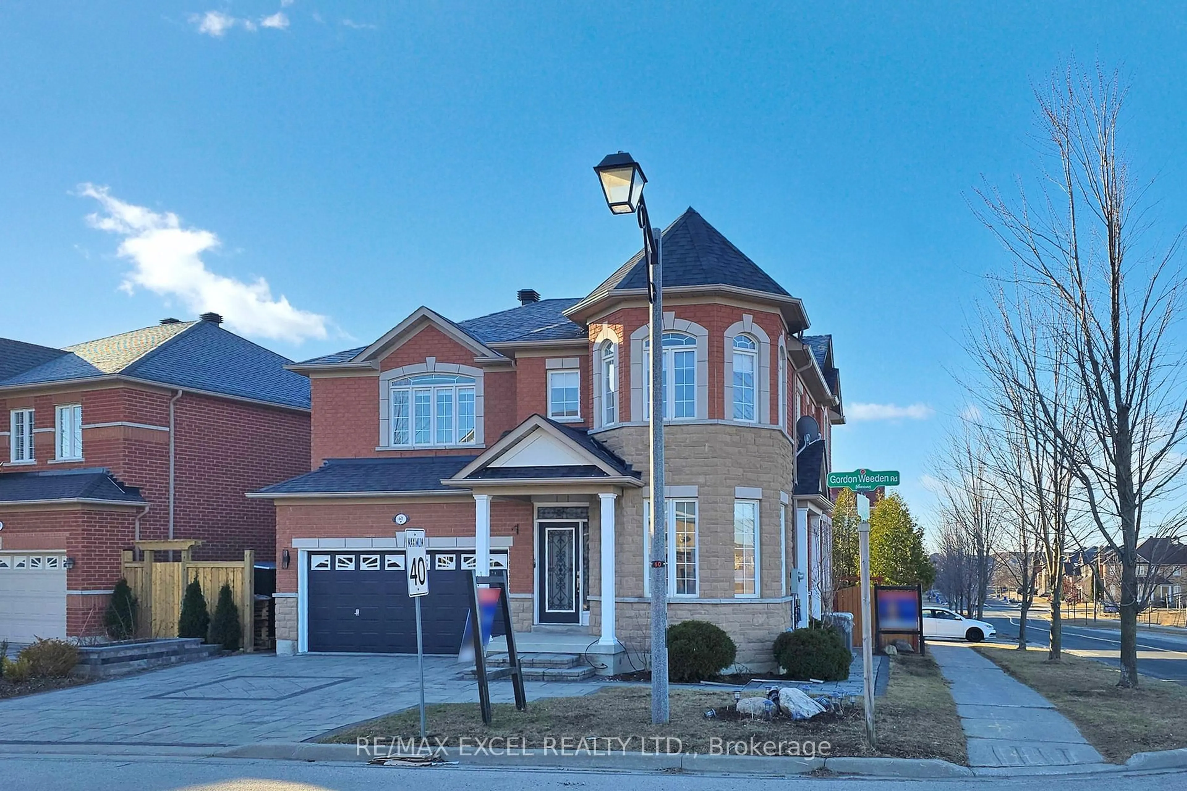 Home with brick exterior material, street for 60 Gordon Weeden Rd, Markham Ontario L6E 2G4