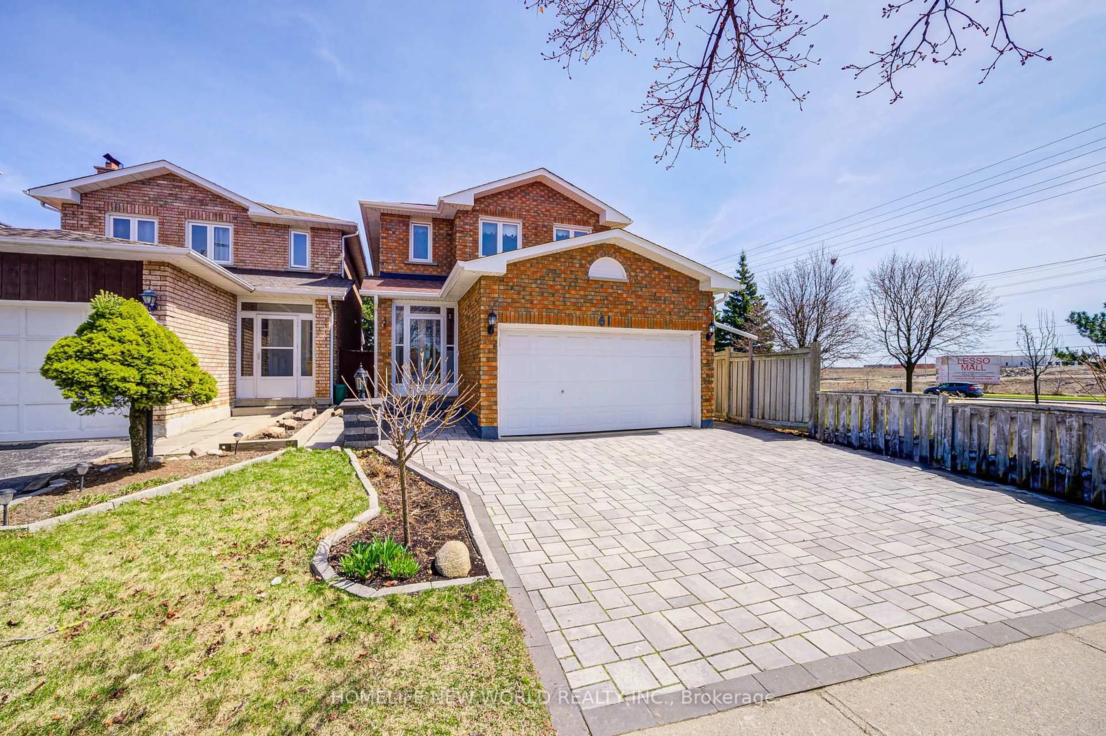 Home with brick exterior material, street for 61 Olivewood Dr, Markham Ontario L3S 3E2