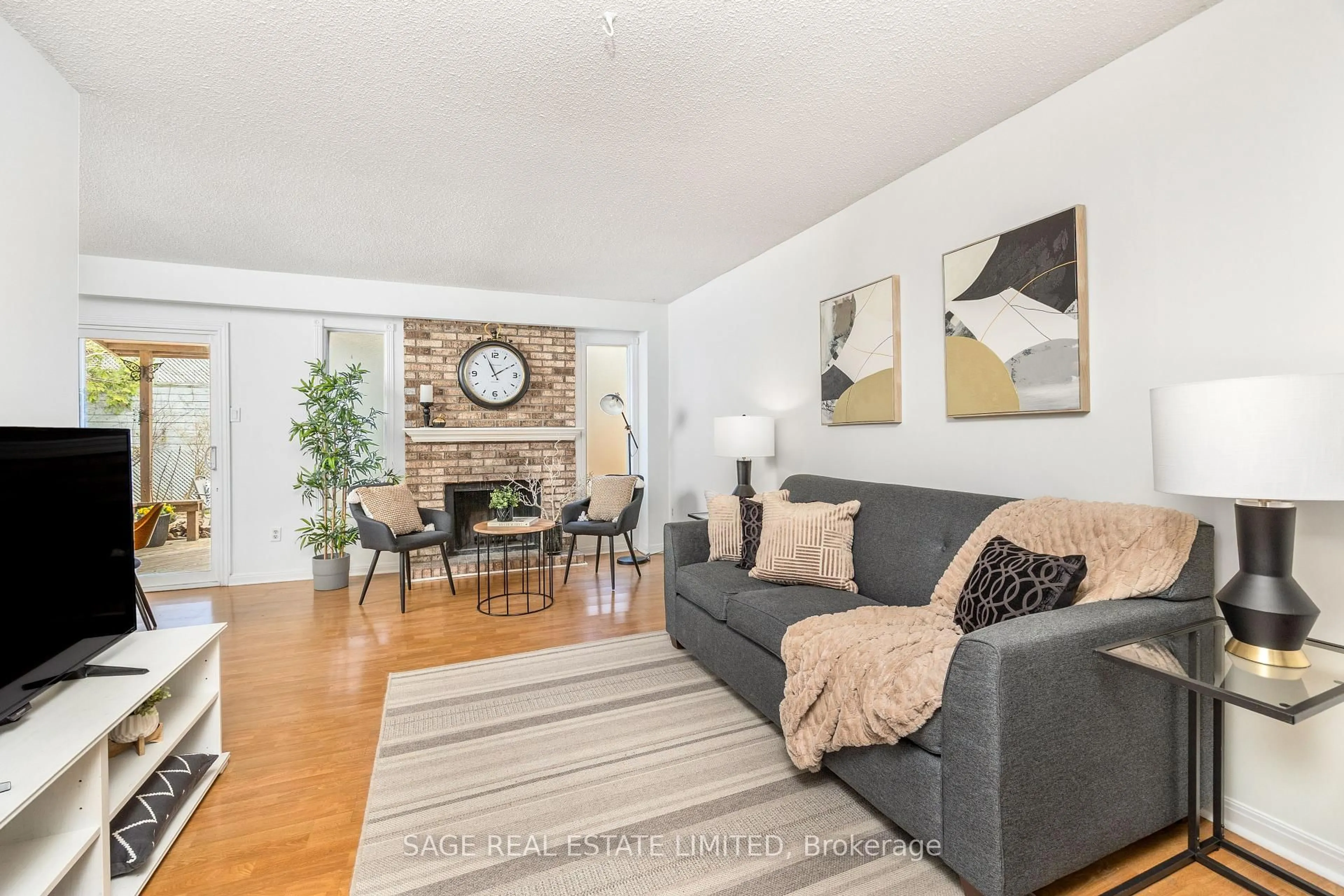 Living room with furniture, wood/laminate floor for 9 Reginald Cres, Markham Ontario L3P 3T6