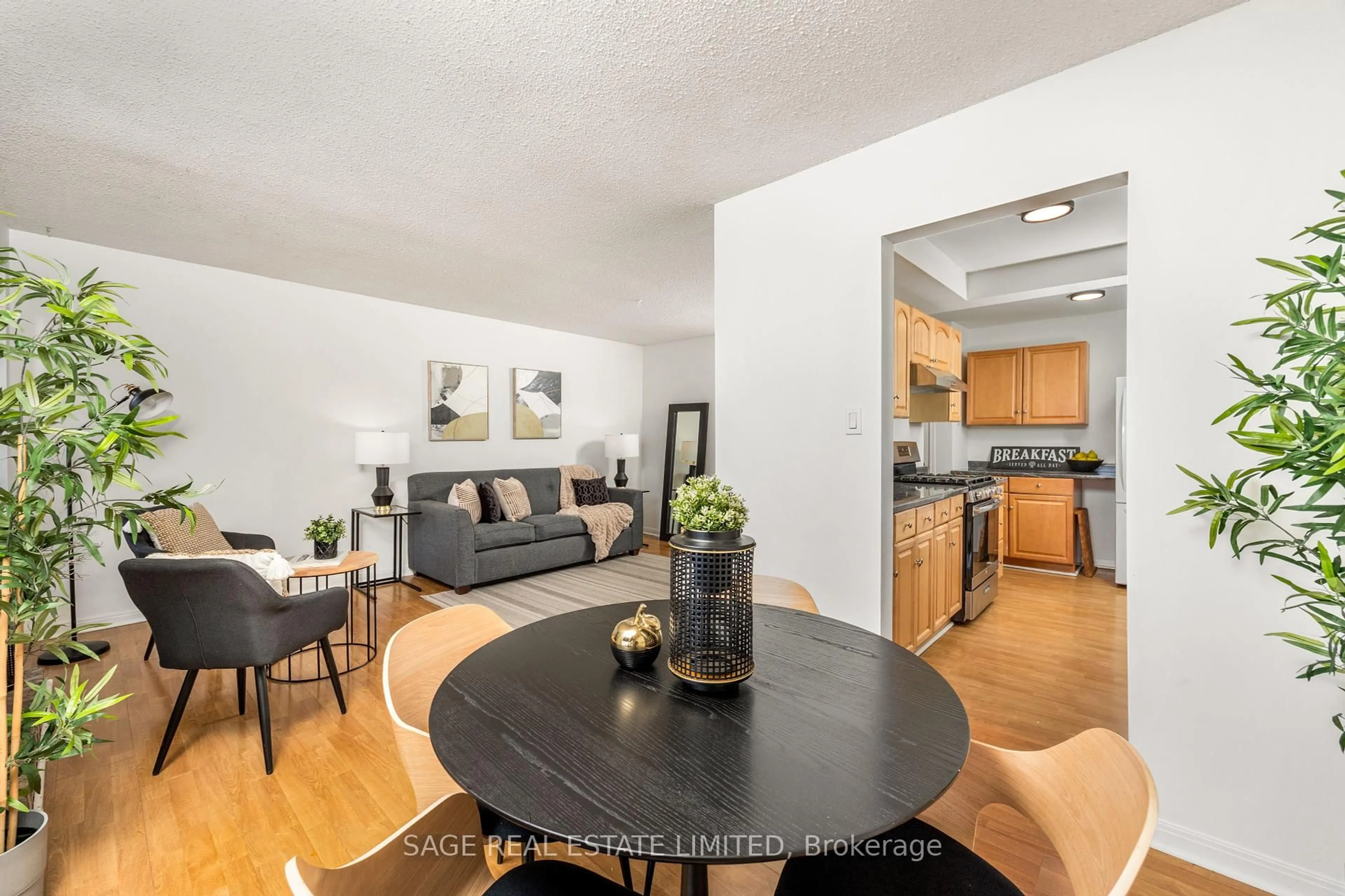 Living room with furniture, wood/laminate floor for 9 Reginald Cres, Markham Ontario L3P 3T6
