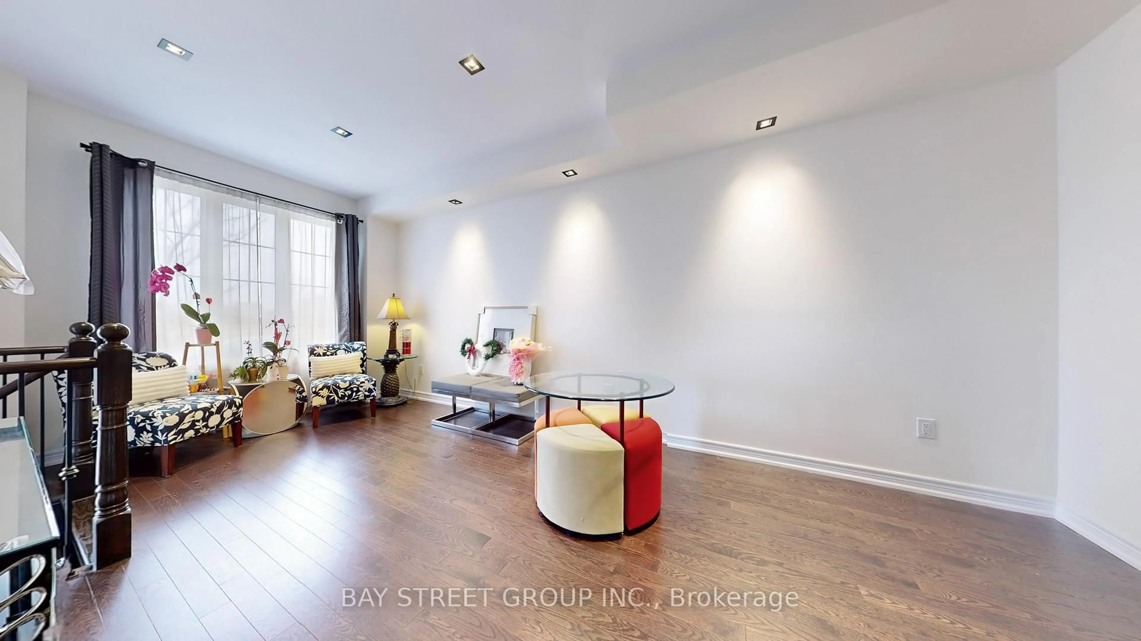 Living room with furniture, wood/laminate floor for 46 Harvest Field Rd, Markham Ontario L6B 1N4