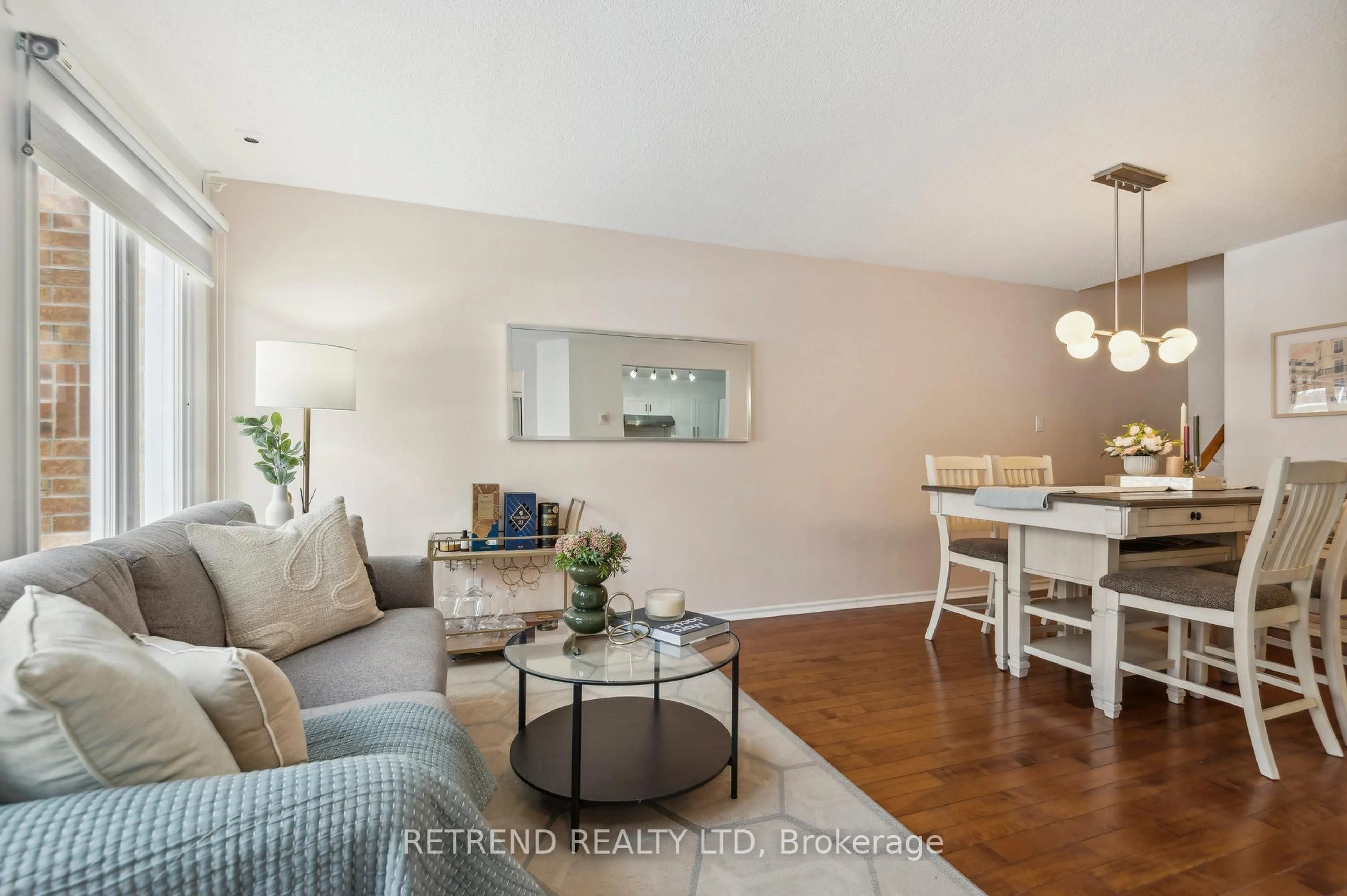 Living room with furniture, wood/laminate floor for 151 Townsgate Dr #95, Vaughan Ontario L4J 8J7