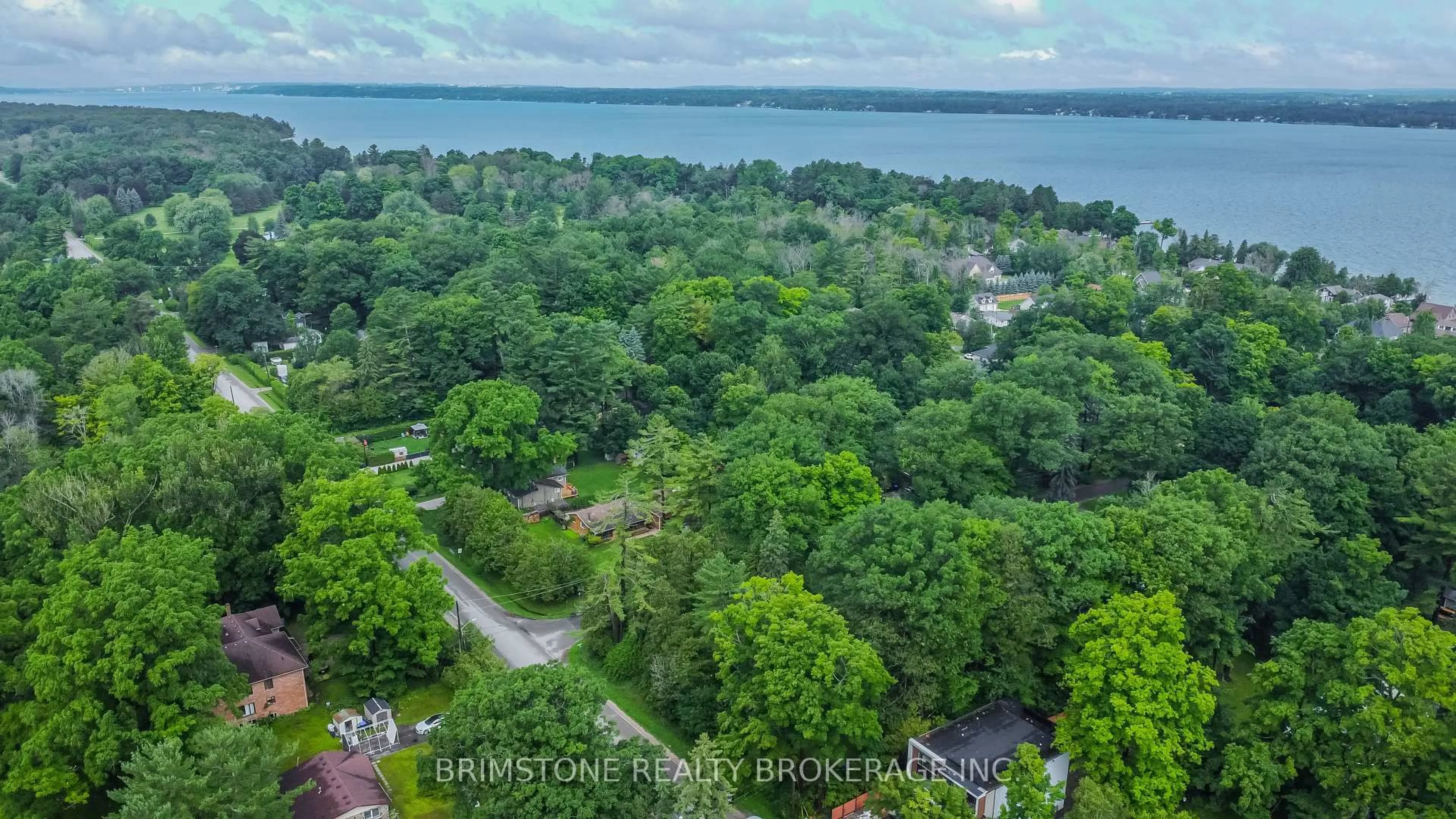 A pic from outside/outdoor area/front of a property/back of a property/a pic from drone, water/lake/river/ocean view for 3923 Algonquin Ave, Innisfil Ontario L9S 2M3
