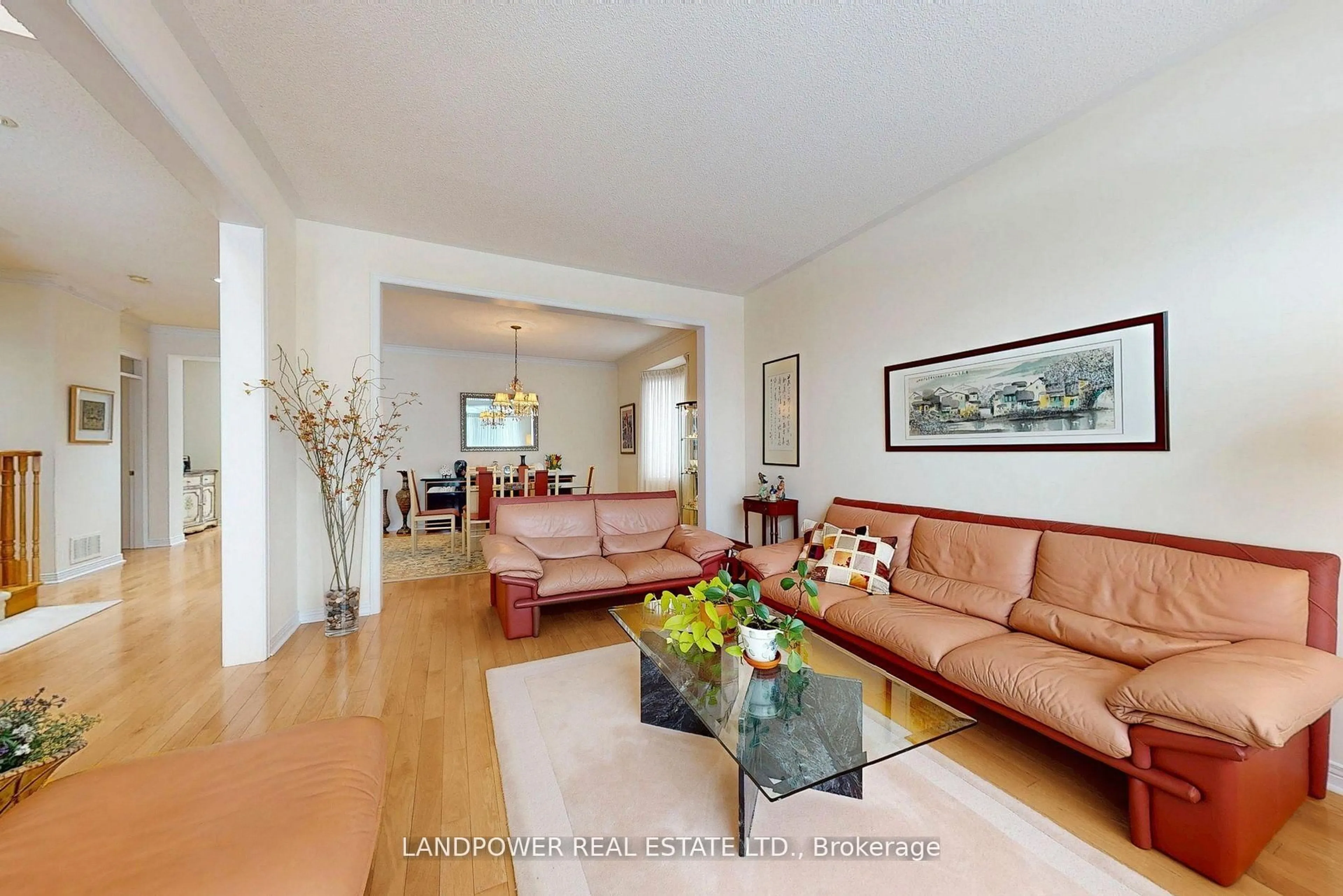Living room with furniture, wood/laminate floor for 77 Burndenford Cres, Markham Ontario L3P 7S9