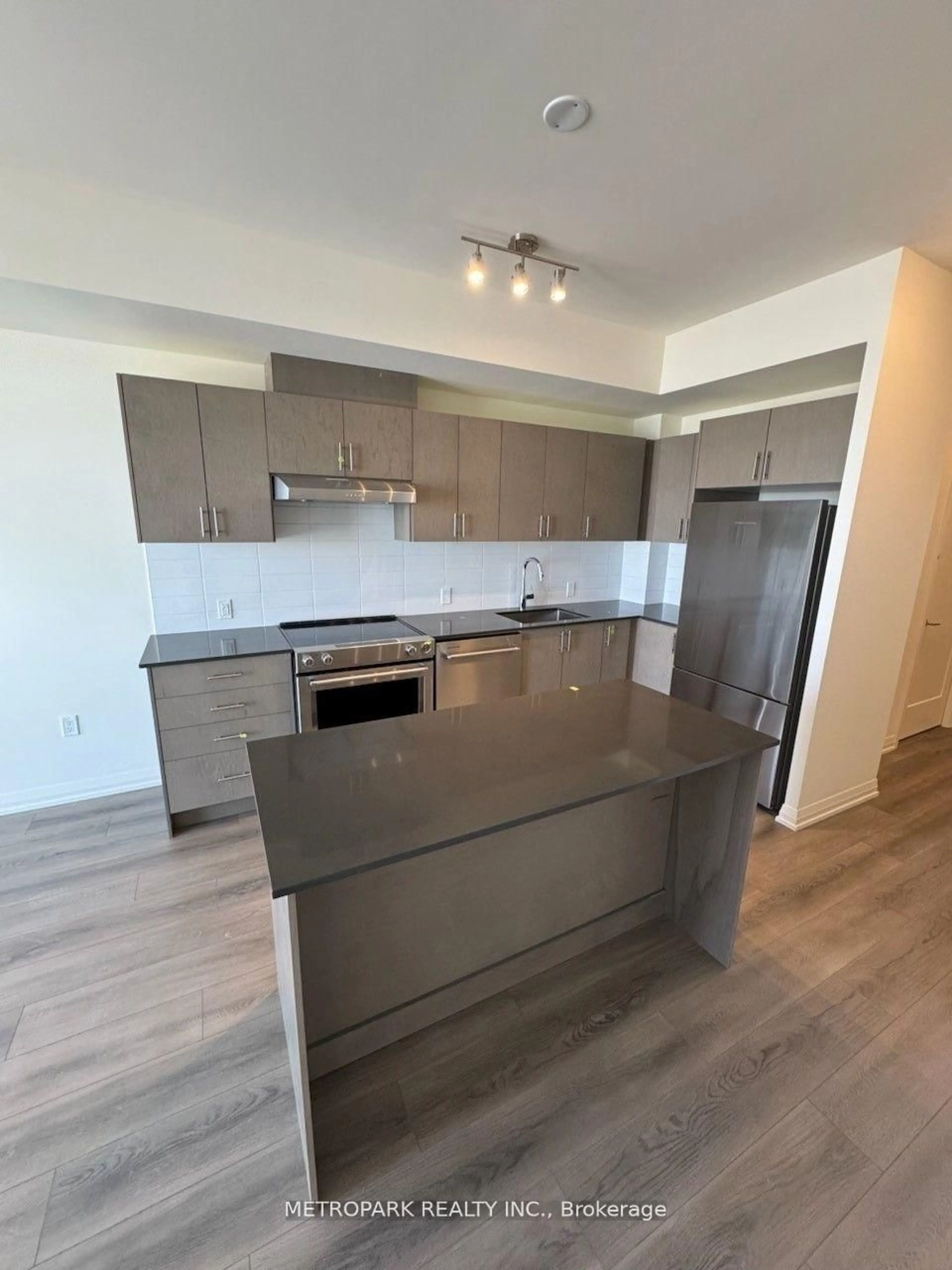 Open concept kitchen, wood/laminate floor for 8960 Jane St #1806, Vaughan Ontario L4K 2M9