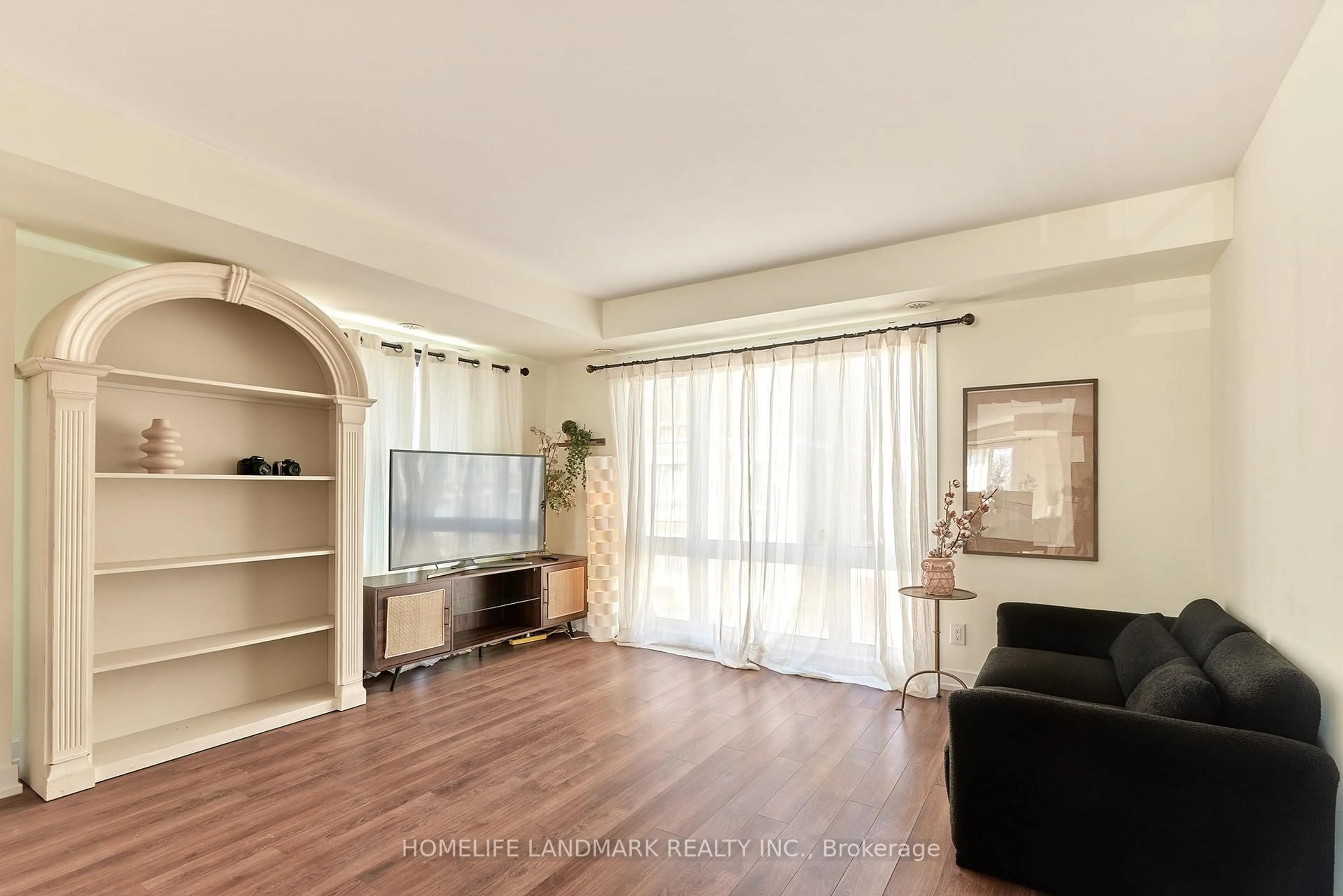 Living room with furniture, wood/laminate floor for 65 Lindcrest Manr #1102, Markham Ontario L6B 1N3