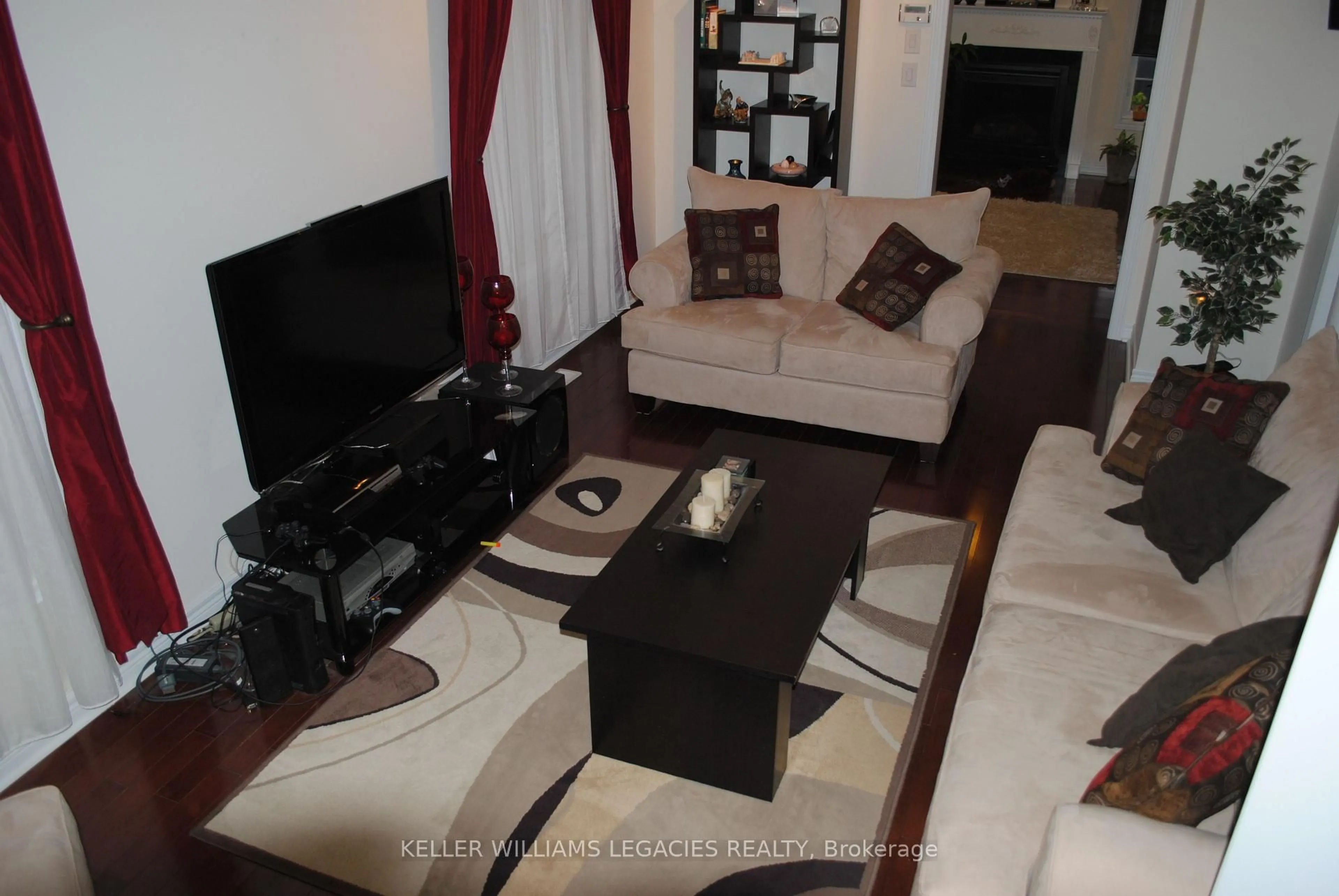 Living room with furniture, wood/laminate floor for 107 Paperbark Ave, Vaughan Ontario L6A 0Y2