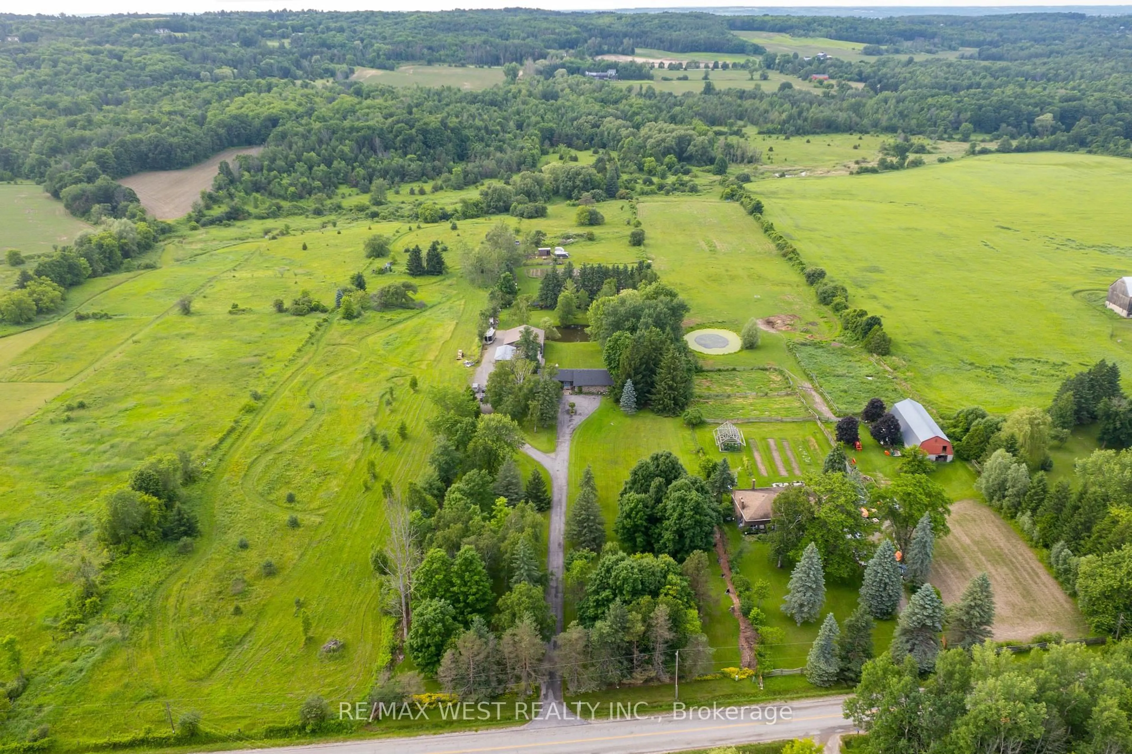A pic from outside/outdoor area/front of a property/back of a property/a pic from drone, forest/trees view for 5878 4th Line, New Tecumseth Ontario L0G 1W0