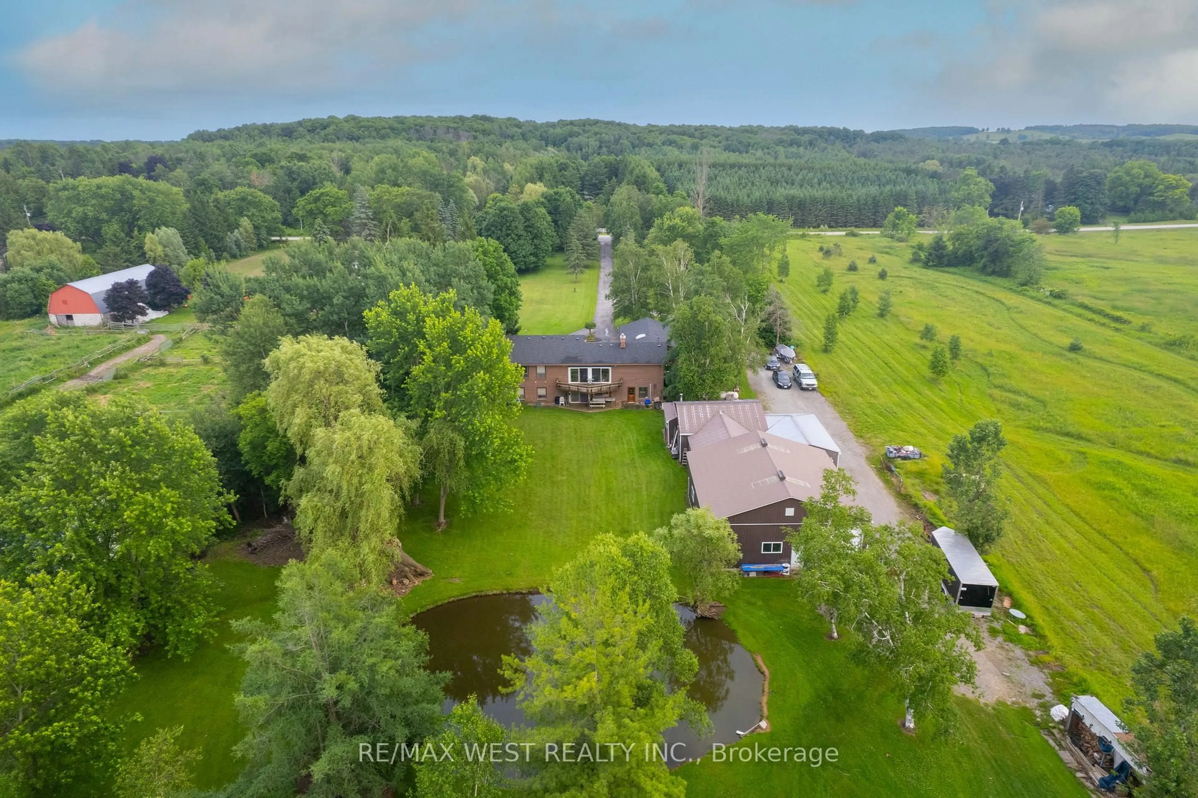 A pic from outside/outdoor area/front of a property/back of a property/a pic from drone, water/lake/river/ocean view for 5878 4th Line, New Tecumseth Ontario L0G 1W0