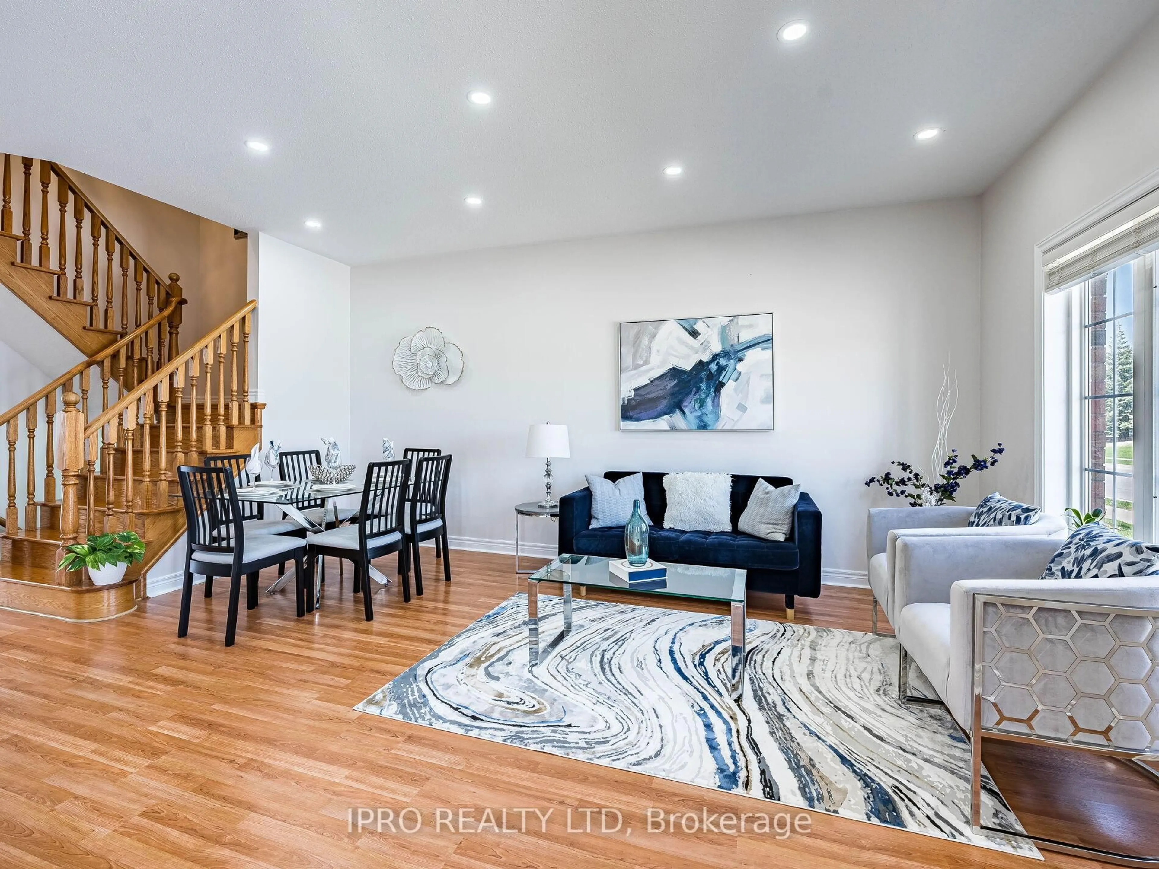 Living room with furniture, wood/laminate floor for 11 Davos Rd, Vaughan Ontario L4H 0P4