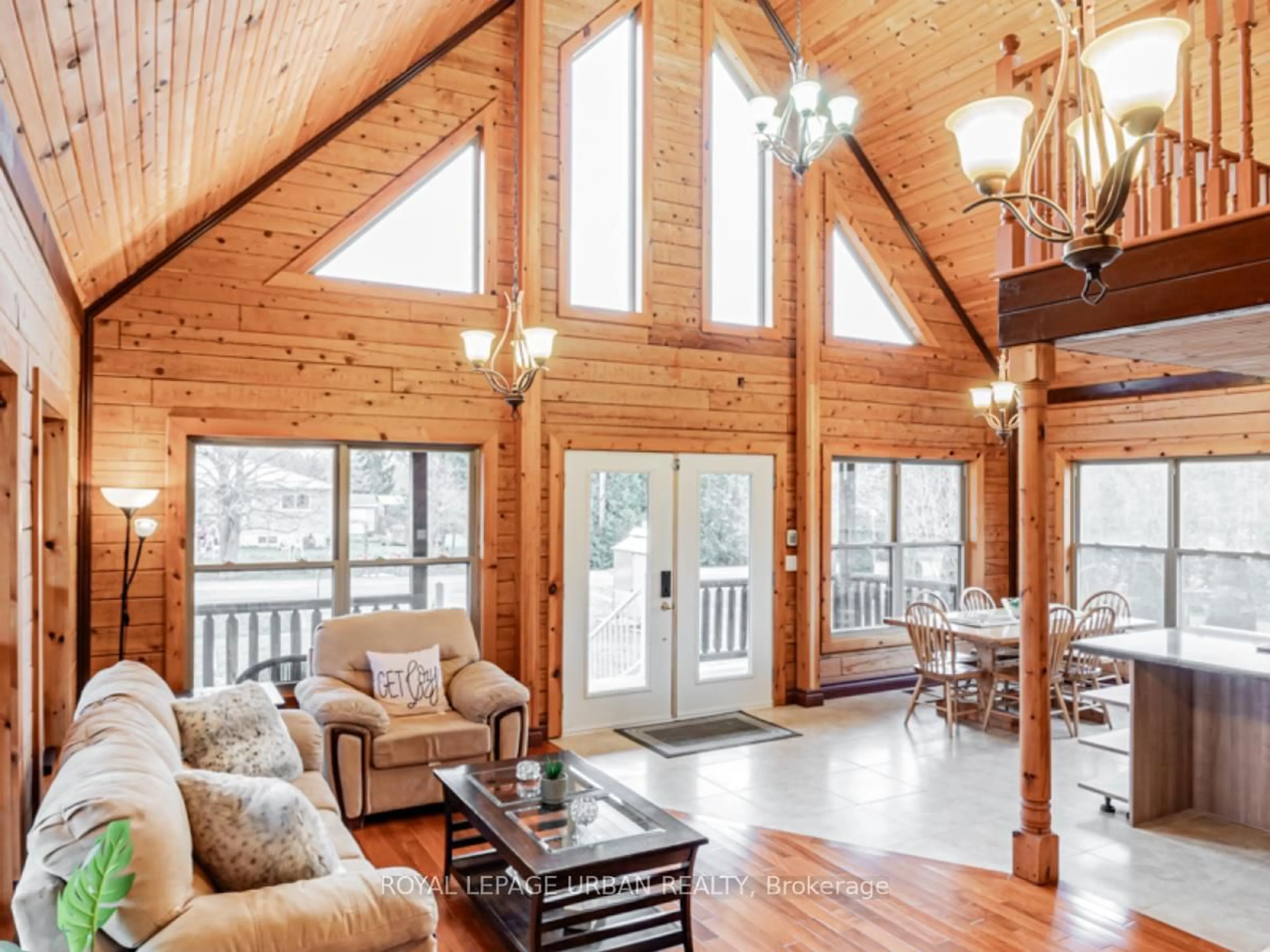 Living room with furniture, wood/laminate floor for 756 Rockaway Rd, Georgina Ontario L0E 1S0