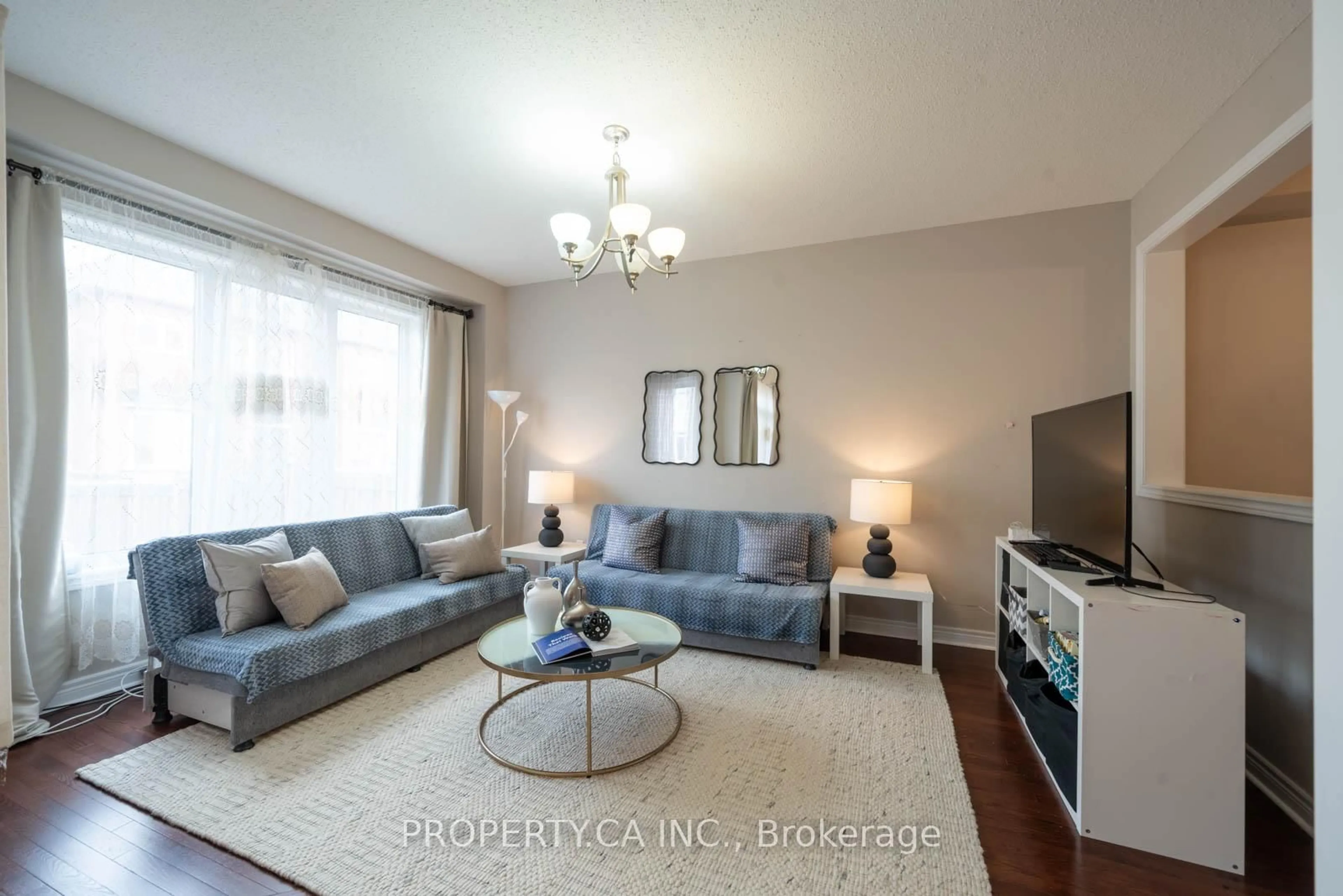 Living room with furniture, wood/laminate floor for 90 Collin Crt, Richmond Hill Ontario L4E 0X8