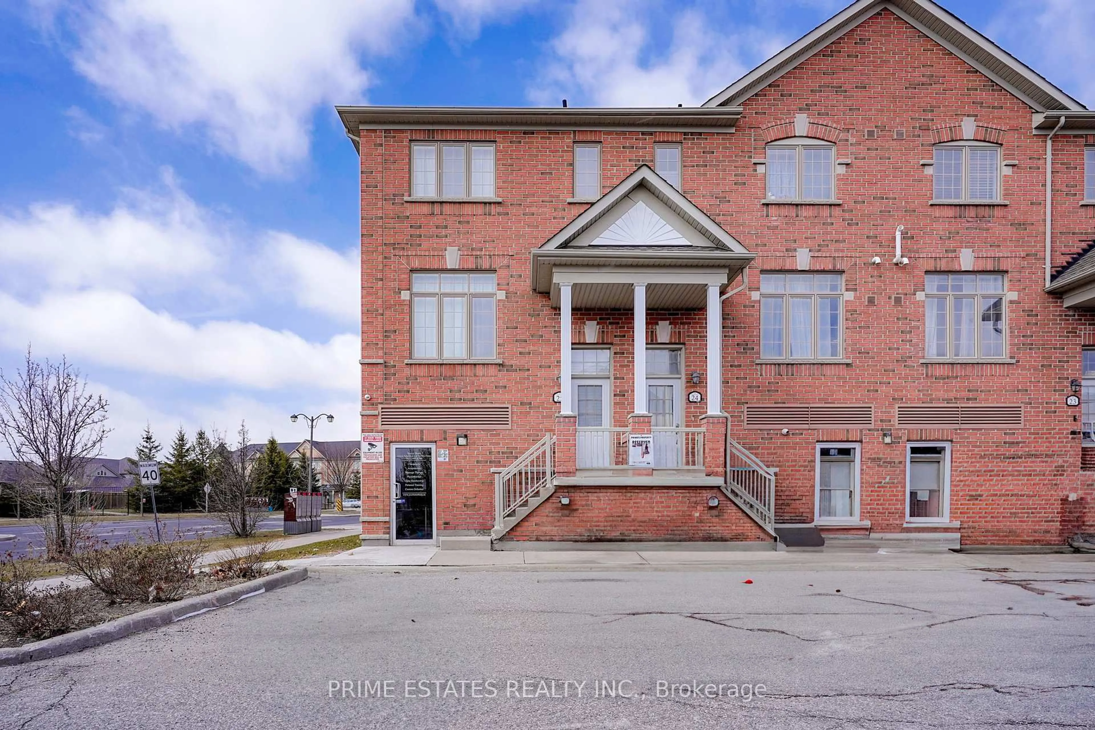 Home with brick exterior material, street for 50 Greensborough Villag Circ #25, Markham Ontario L6E 0C7