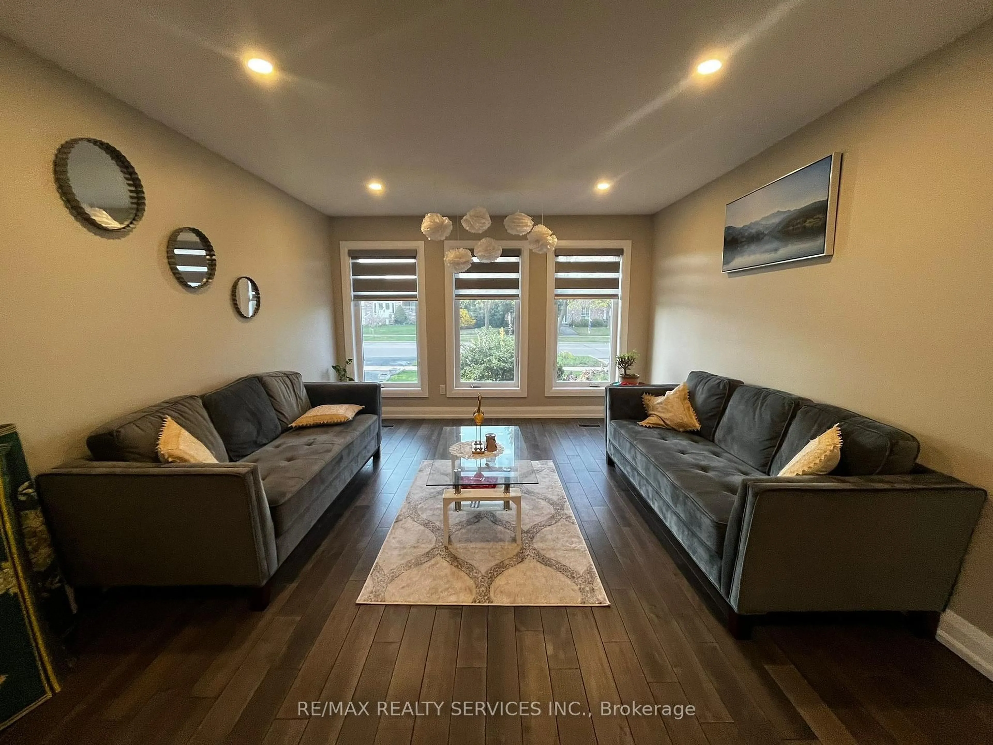 Living room with furniture, wood/laminate floor for 97 Wigwoss Dr, Vaughan Ontario L4L 2P9