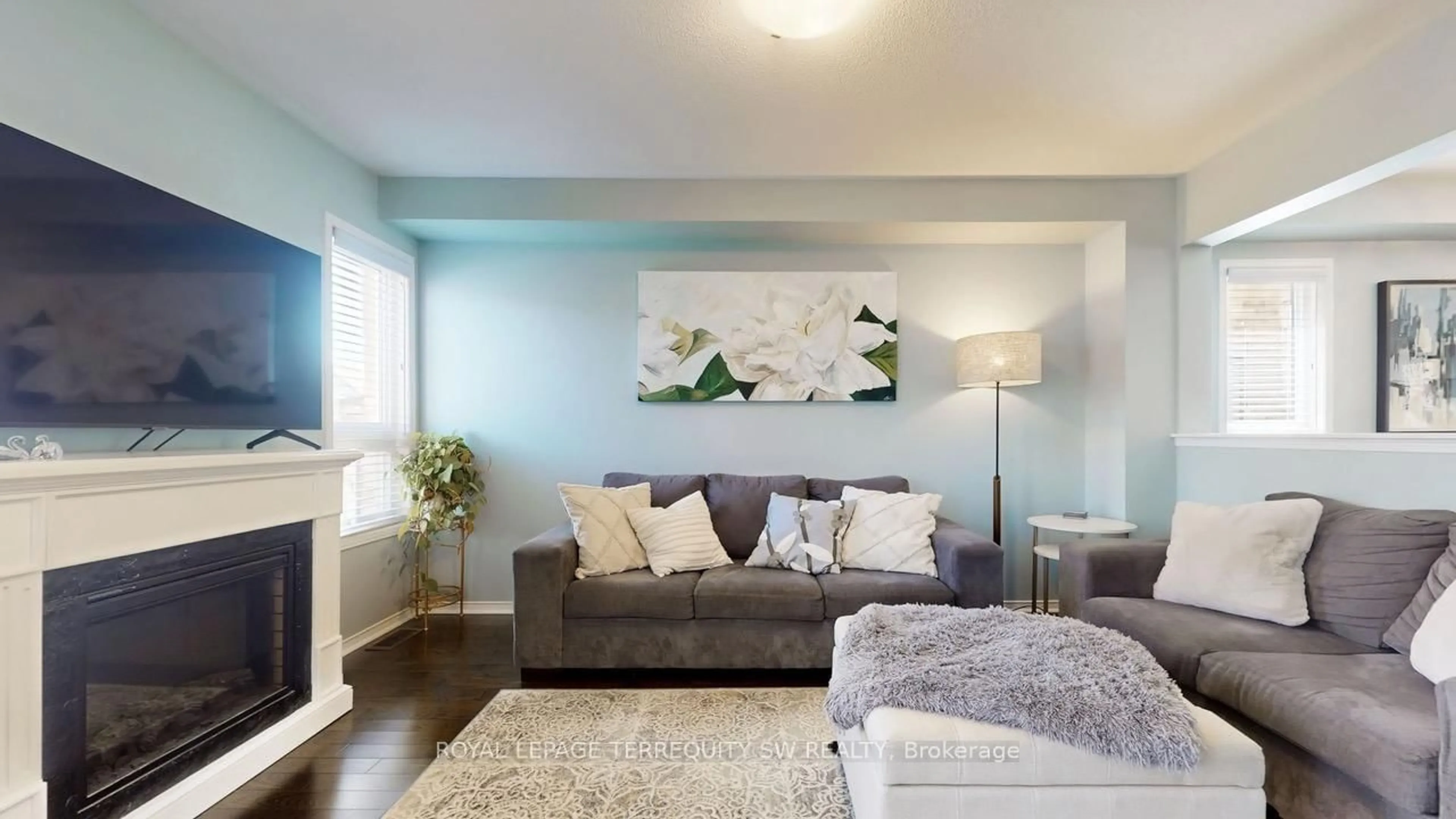 Living room with furniture, wood/laminate floor for 343 Langford Blvd, Bradford West Gwillimbury Ontario L3Z 0P7