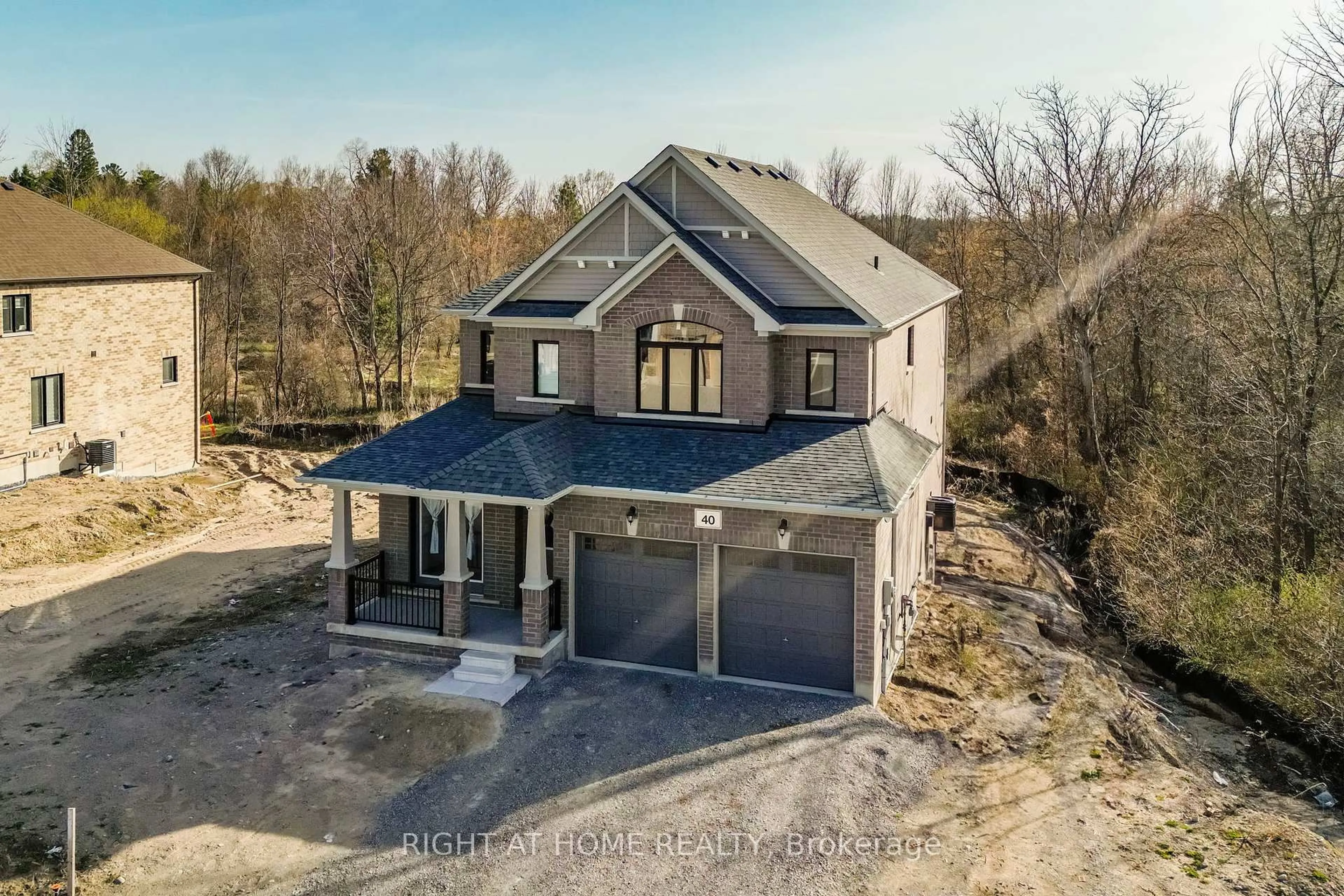 A pic from outside/outdoor area/front of a property/back of a property/a pic from drone, building for 40 Baycroft Blvd, Essa Ontario L3W 0M1