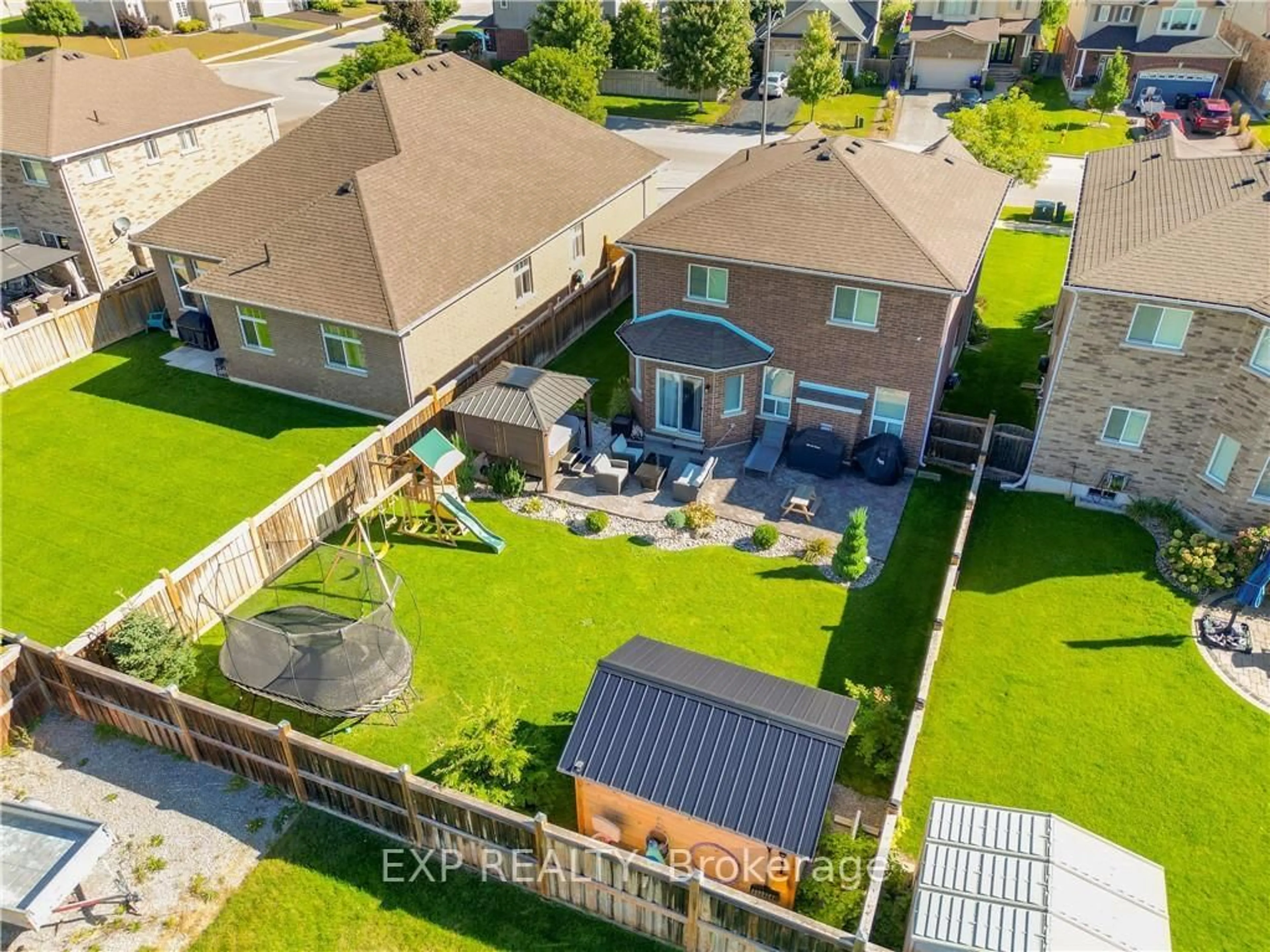 A pic from outside/outdoor area/front of a property/back of a property/a pic from drone, street for 452 Greenwood Dr, Essa Ontario L0M 1B6