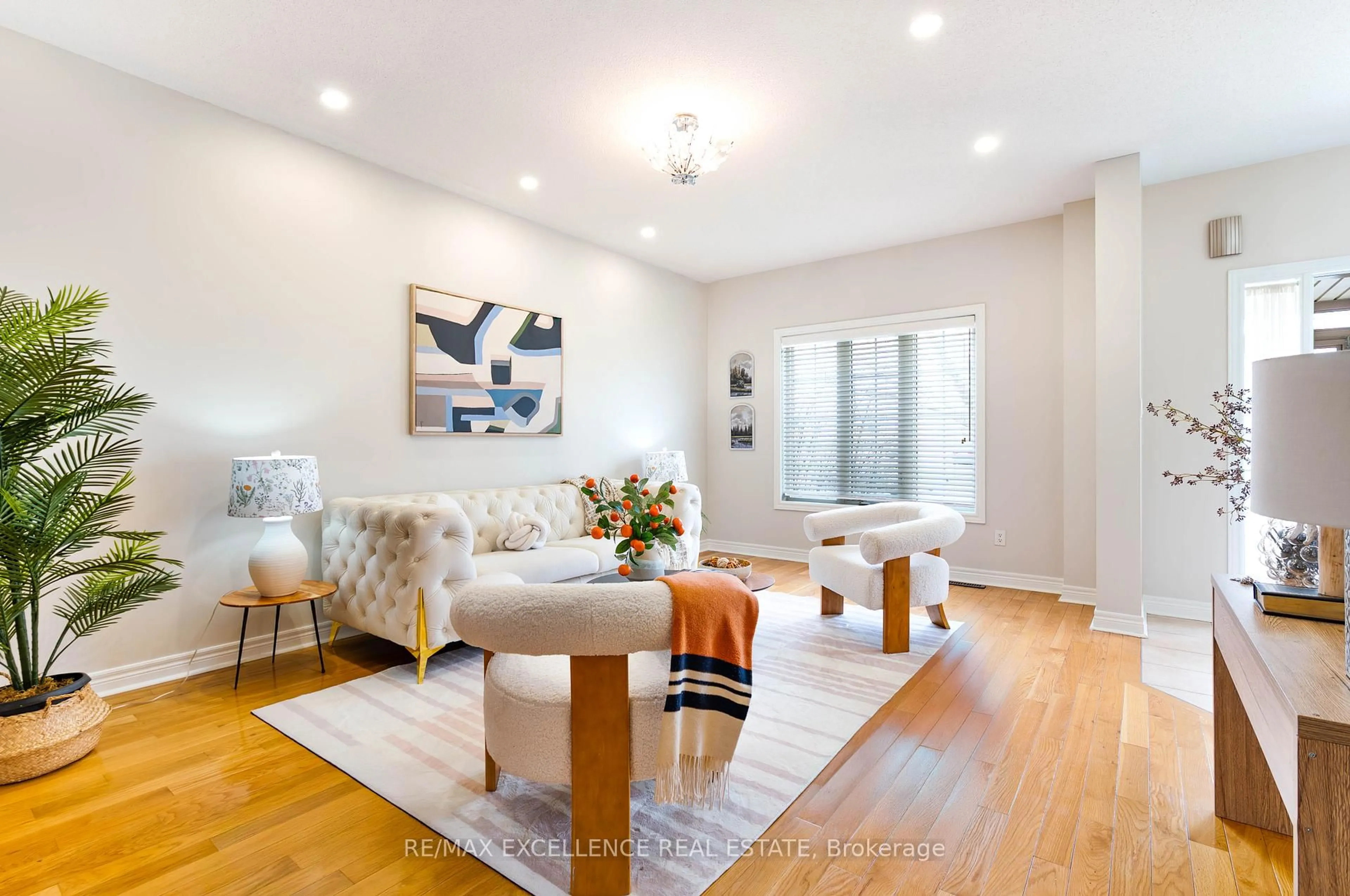 Living room with furniture, wood/laminate floor for 41 Davos Rd, Vaughan Ontario L4H 2Y1