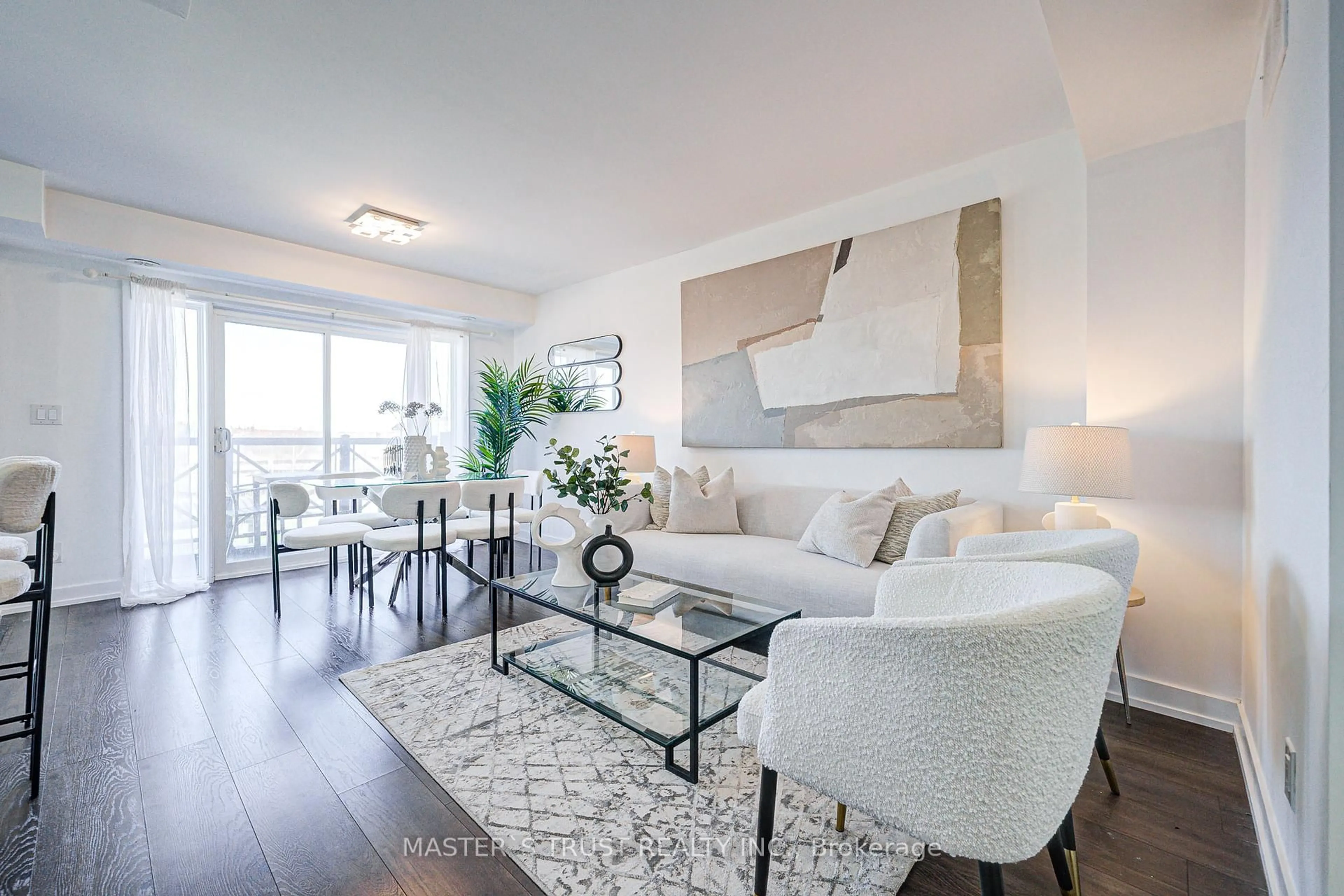 Living room with furniture, wood/laminate floor for 10 Dunsheath Way #215, Markham Ontario L6B 1N3
