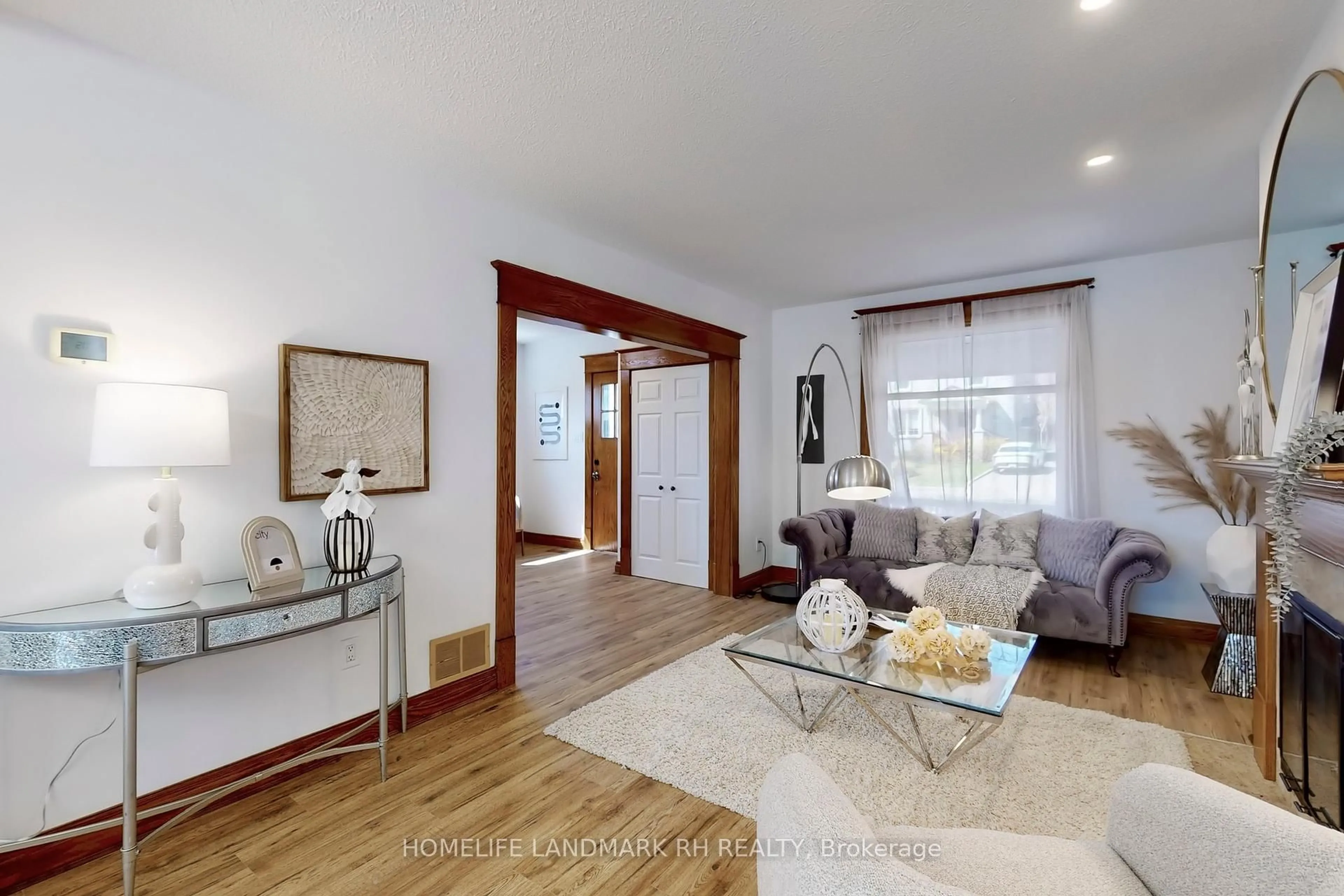 Living room with furniture, wood/laminate floor for 107 Church St, Richmond Hill Ontario L4C 1W4