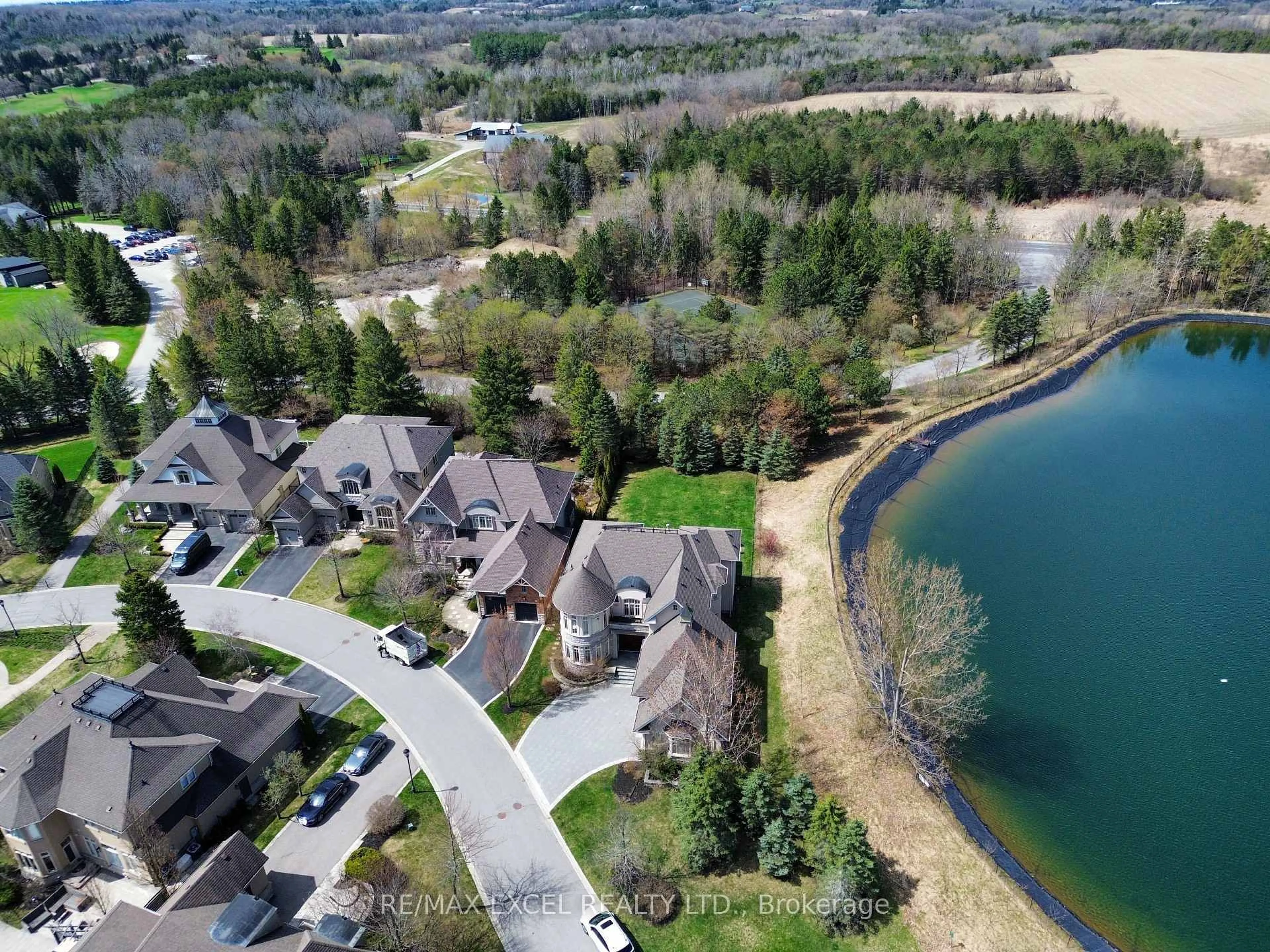 A pic from outside/outdoor area/front of a property/back of a property/a pic from drone, water/lake/river/ocean view for 8 Country Club Dr, King Ontario L7B 1M5