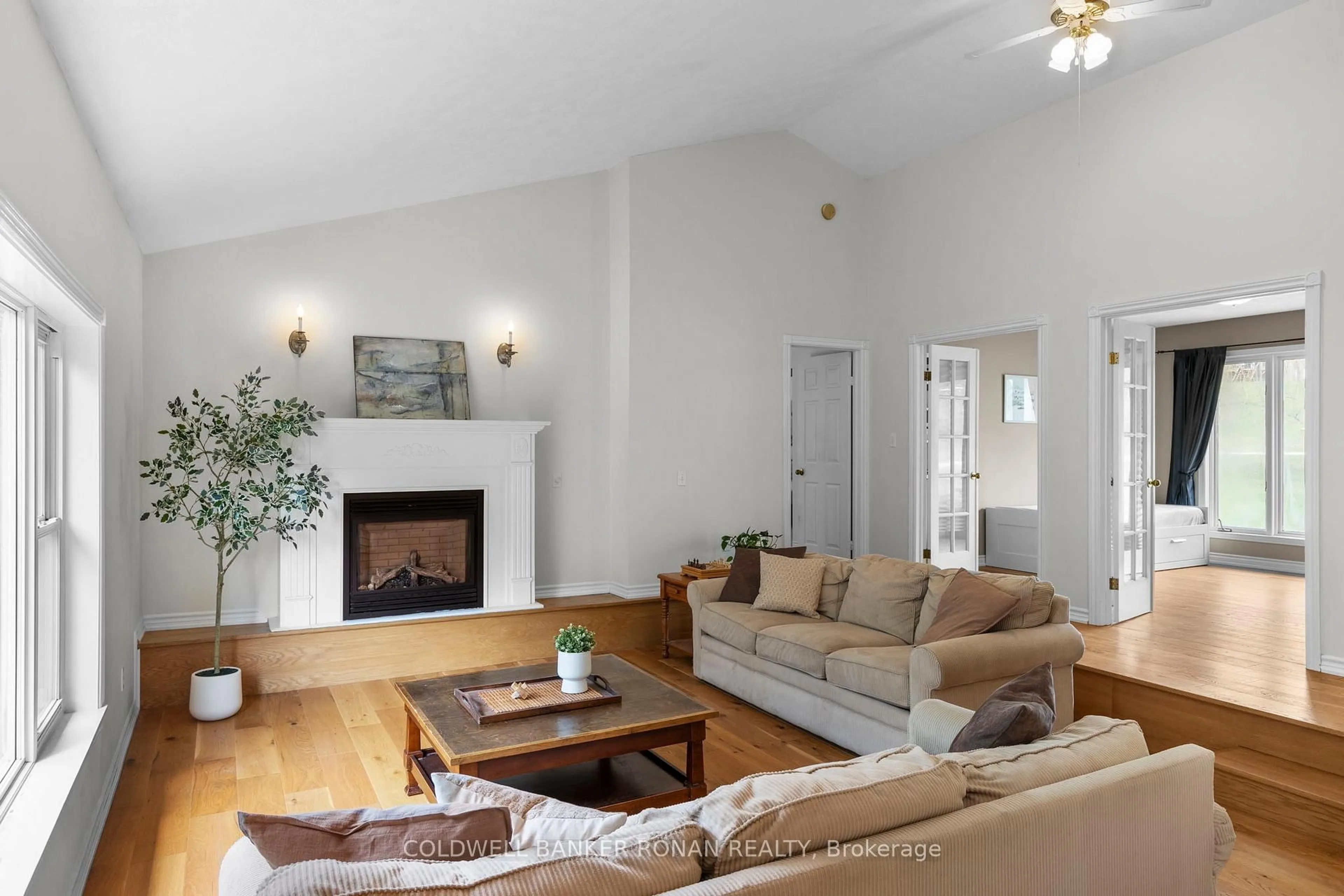 Living room with furniture, wood/laminate floor for 10 Margaret Ave, Adjala-Tosorontio Ontario L0M 1J0