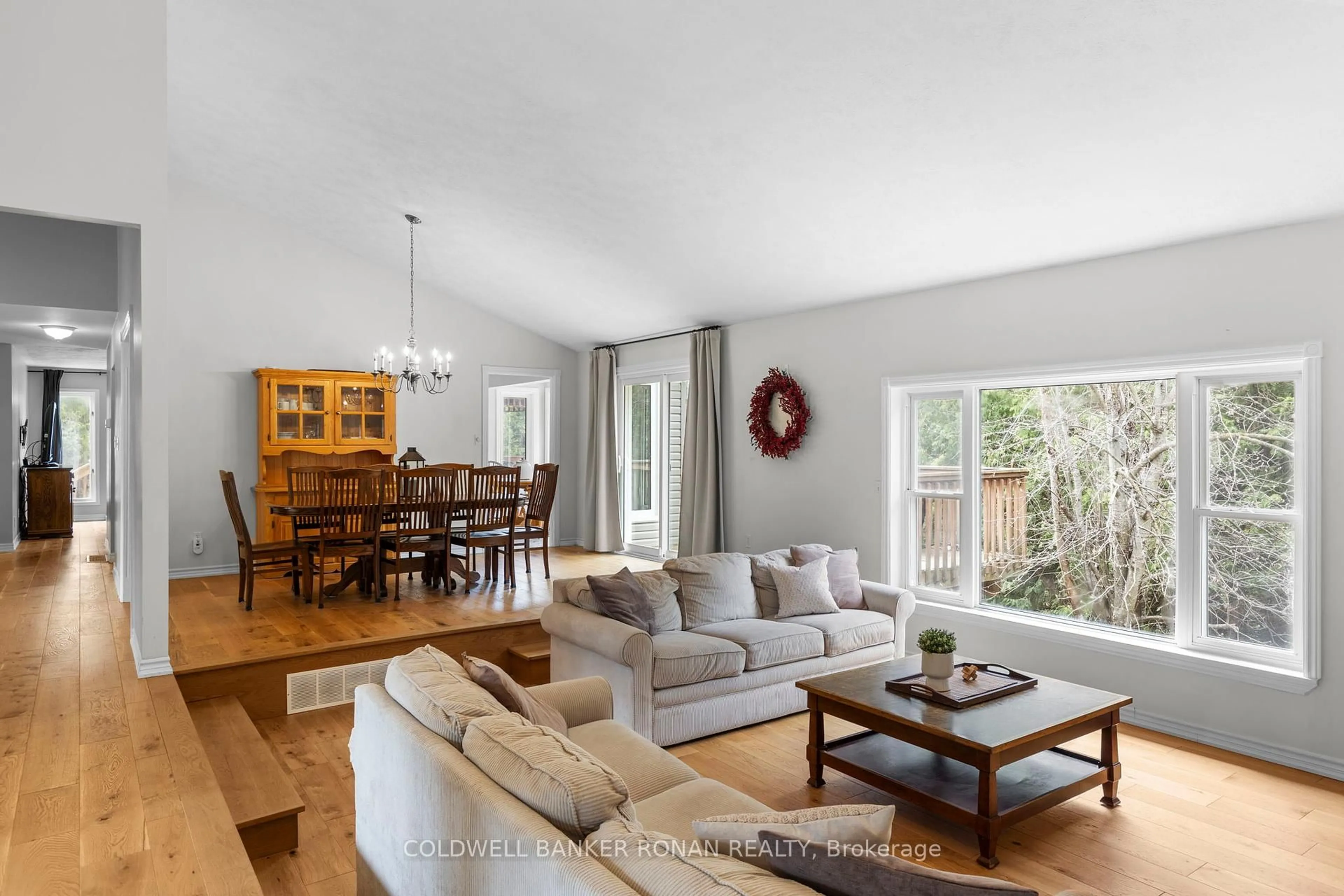 Living room with furniture, wood/laminate floor for 10 Margaret Ave, Adjala-Tosorontio Ontario L0M 1J0