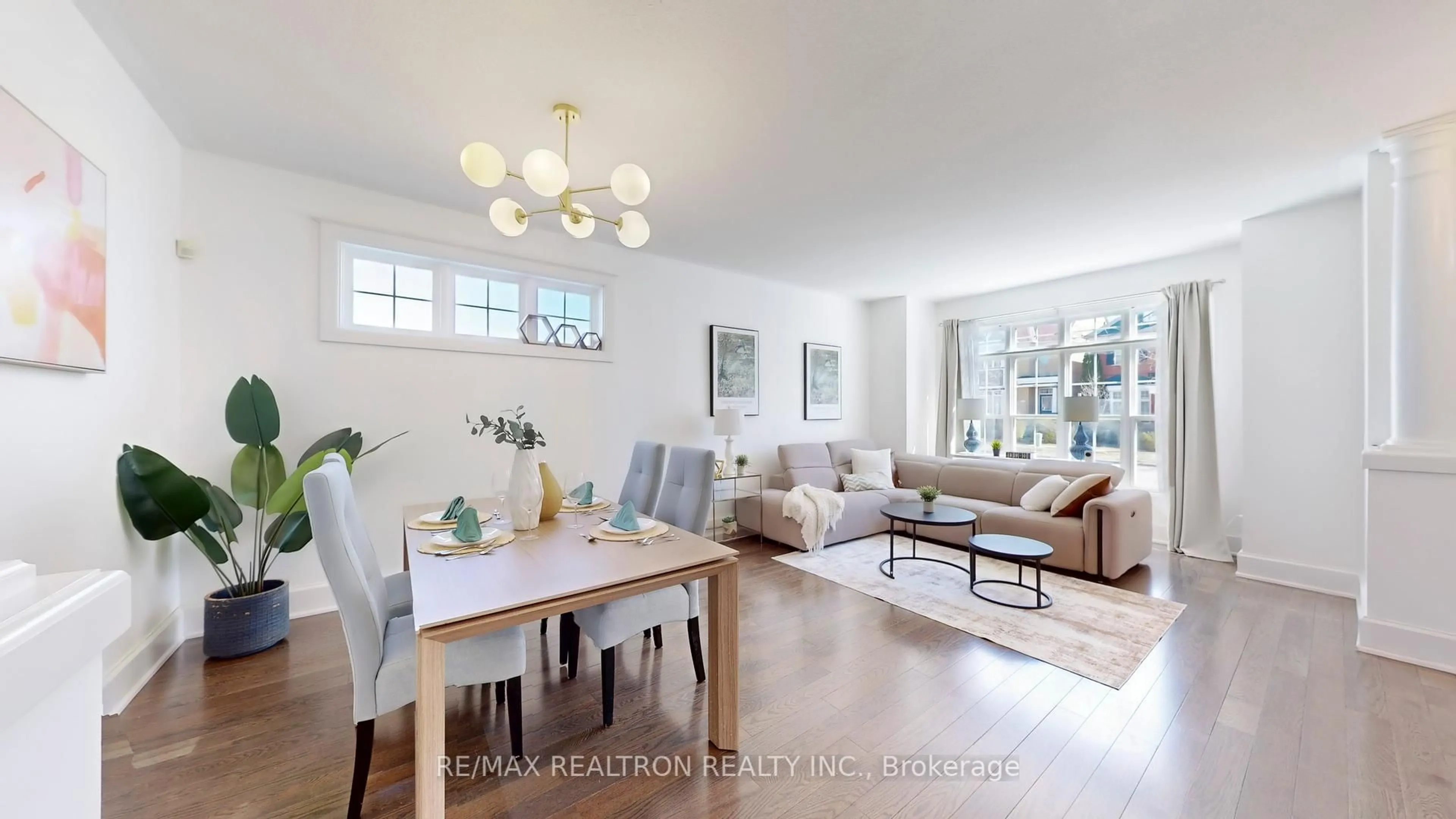 Living room with furniture, wood/laminate floor for 78 Prospector's Dr, Markham Ontario L6C 1Z1