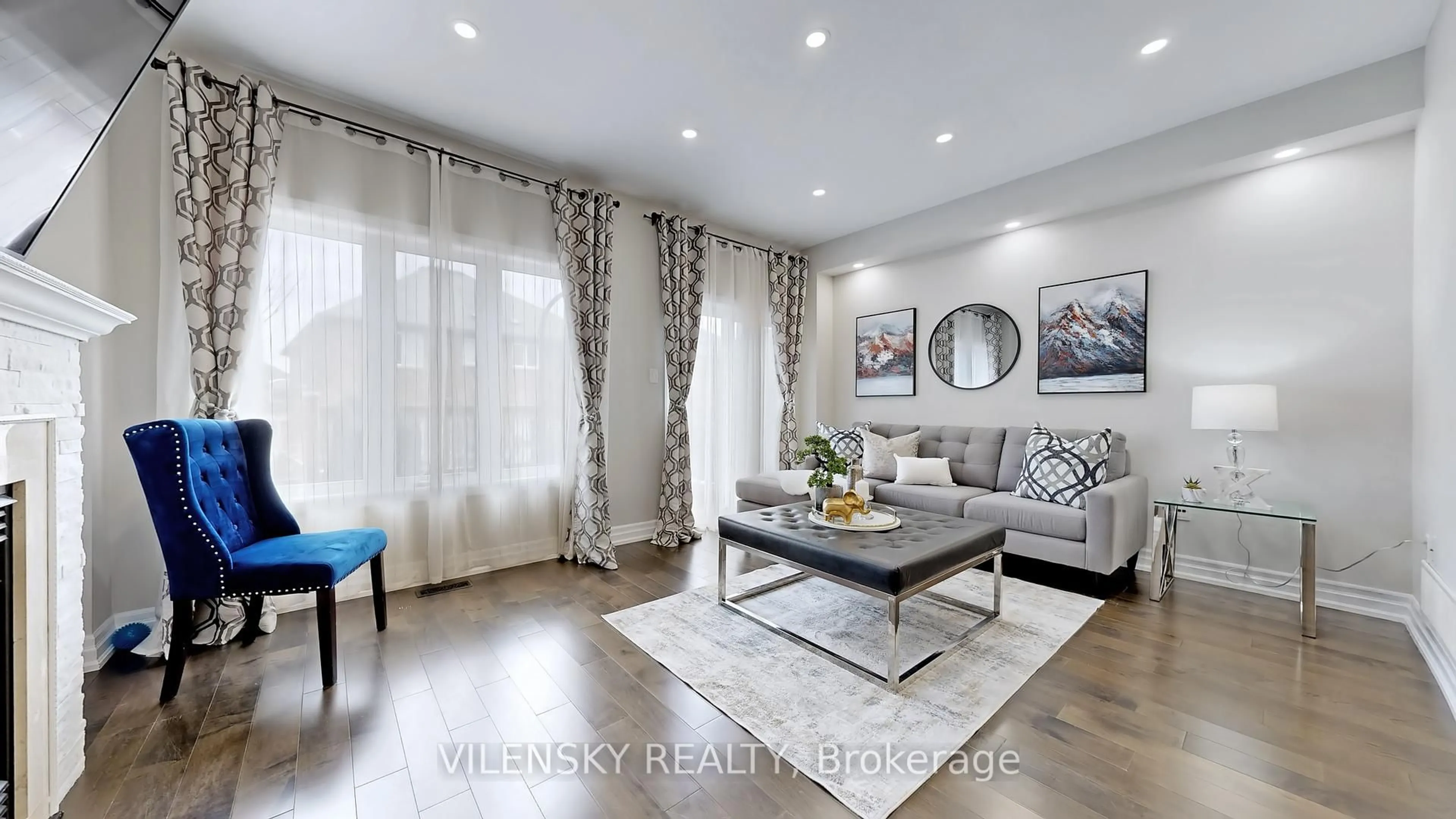 Living room with furniture, wood/laminate floor for 57 Landwood Ave, Vaughan Ontario L4J 0B9