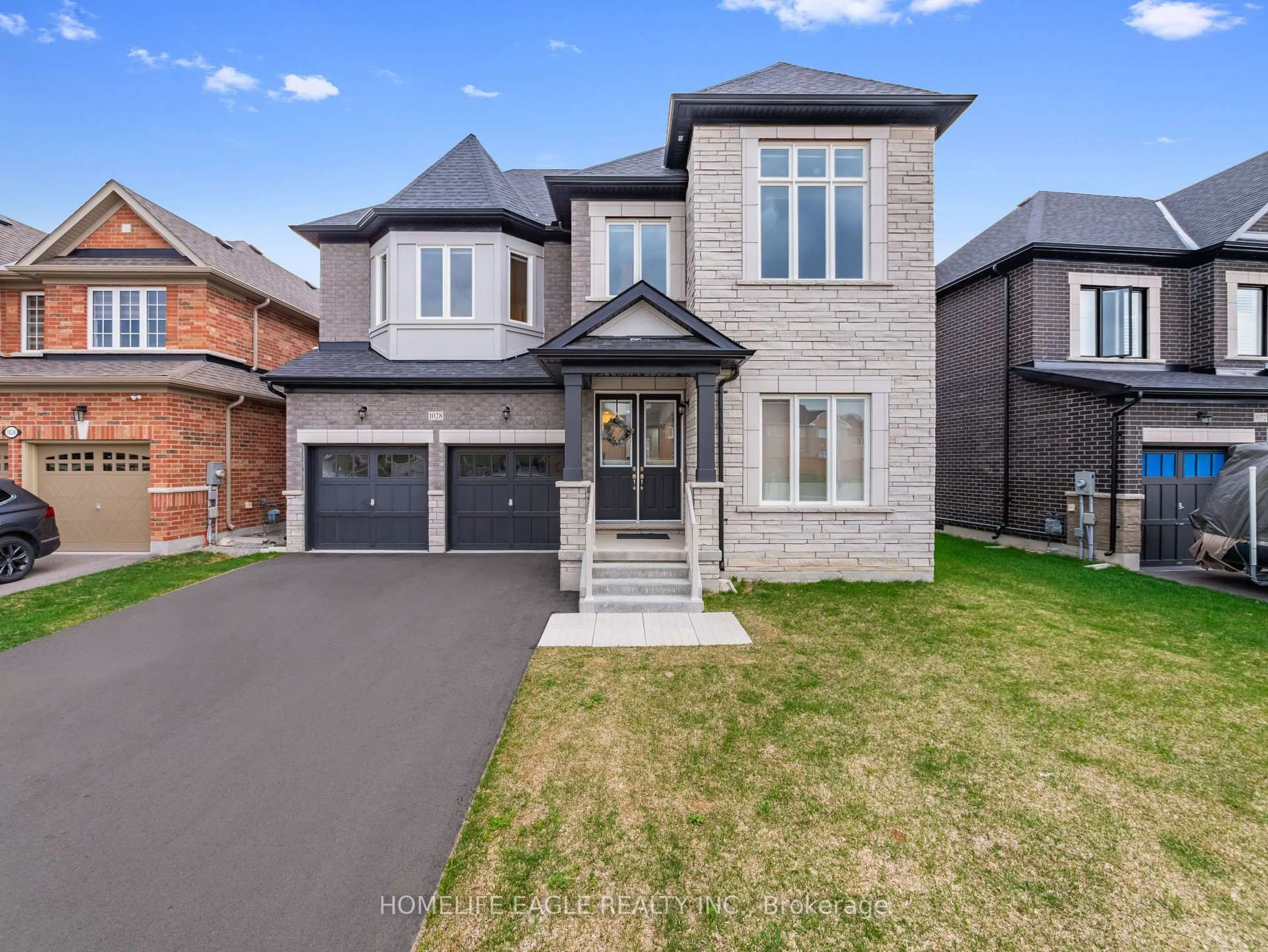 Home with brick exterior material, street for 1028 Hardy Way, Innisfil Ontario L0L 1W0